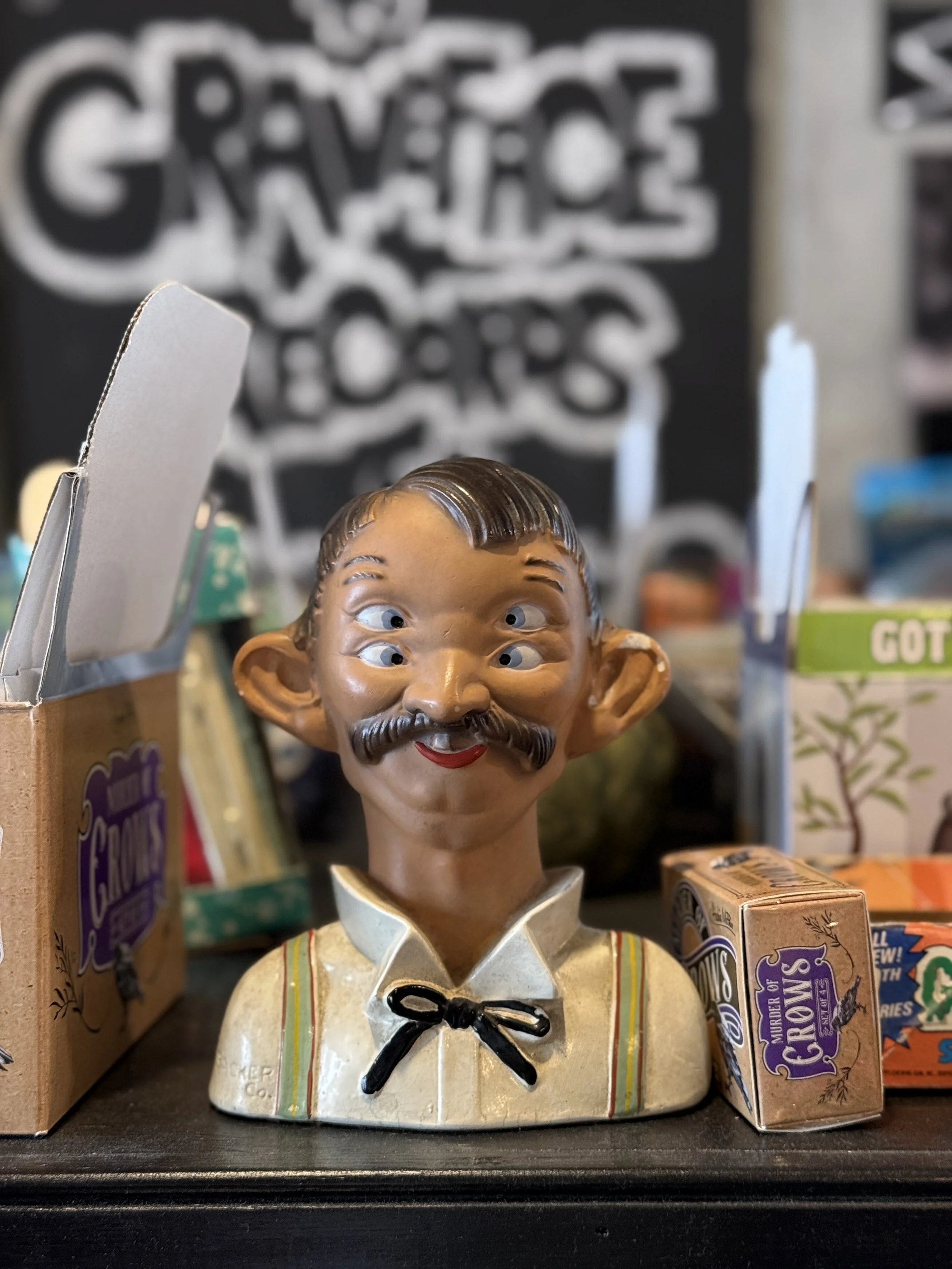 A bust of a man with four eyes and mustache at Graveface Records in the Starland District in Savannah, Georgia