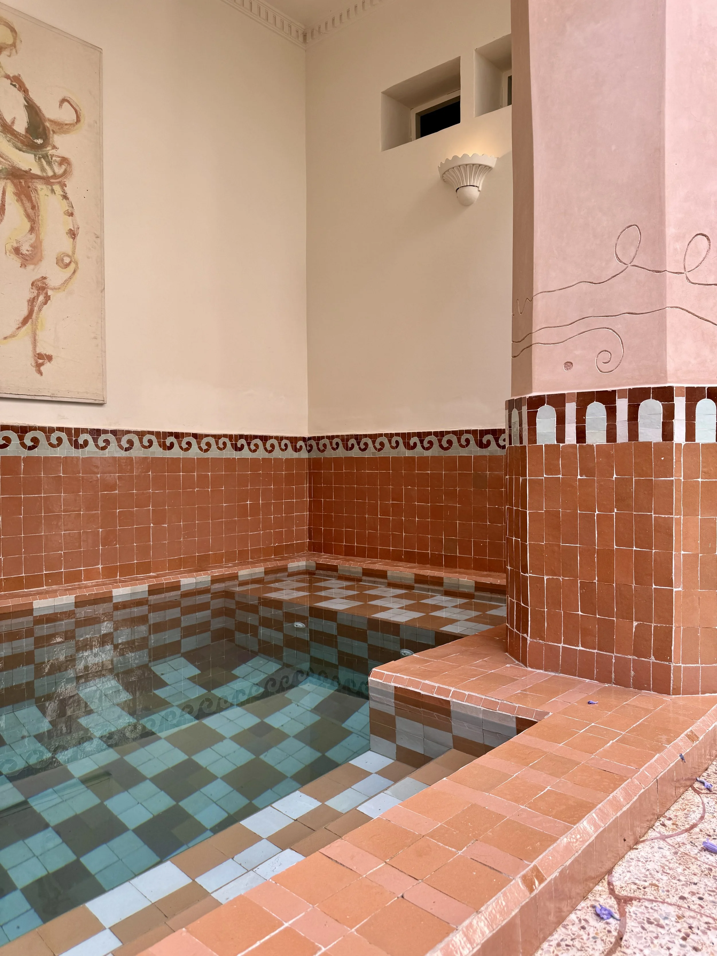 The plunge pool with checkered floor at Riad Rosemary in Marrakech