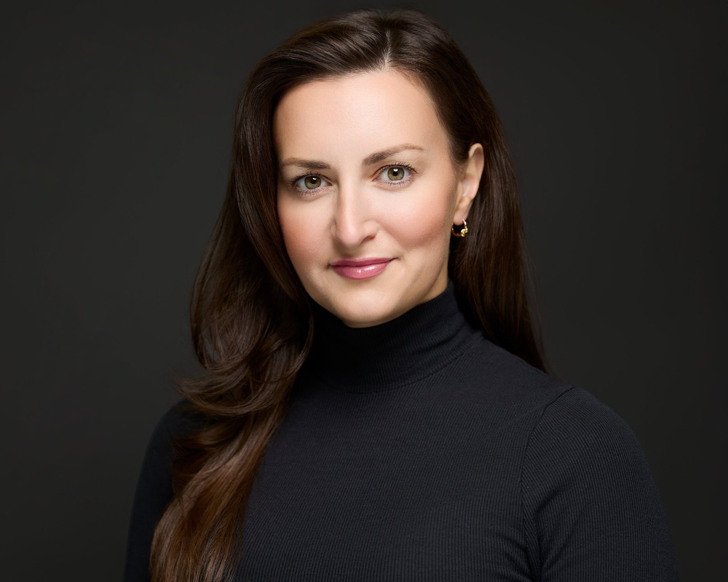 Executive headshot showing intentional expression and energy