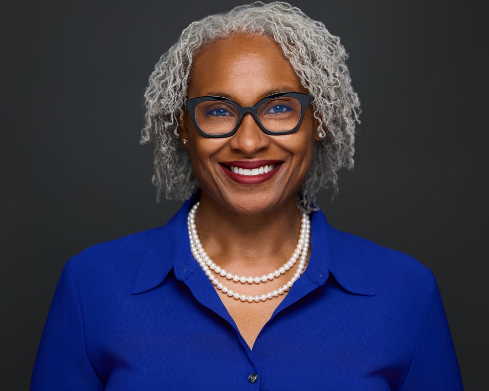 Professional headshot of a woman wearing glasses in Charlotte NC by mjwphoto