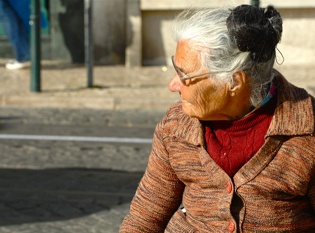  Old woman sitting outside 