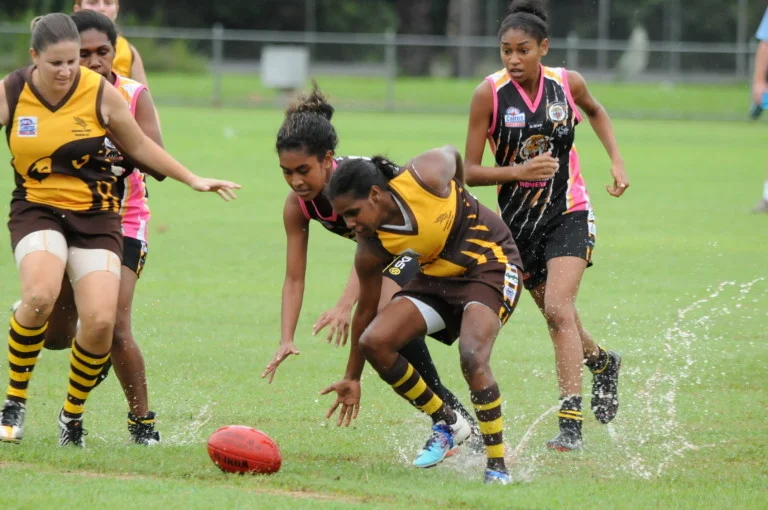  Women playing Australian football 