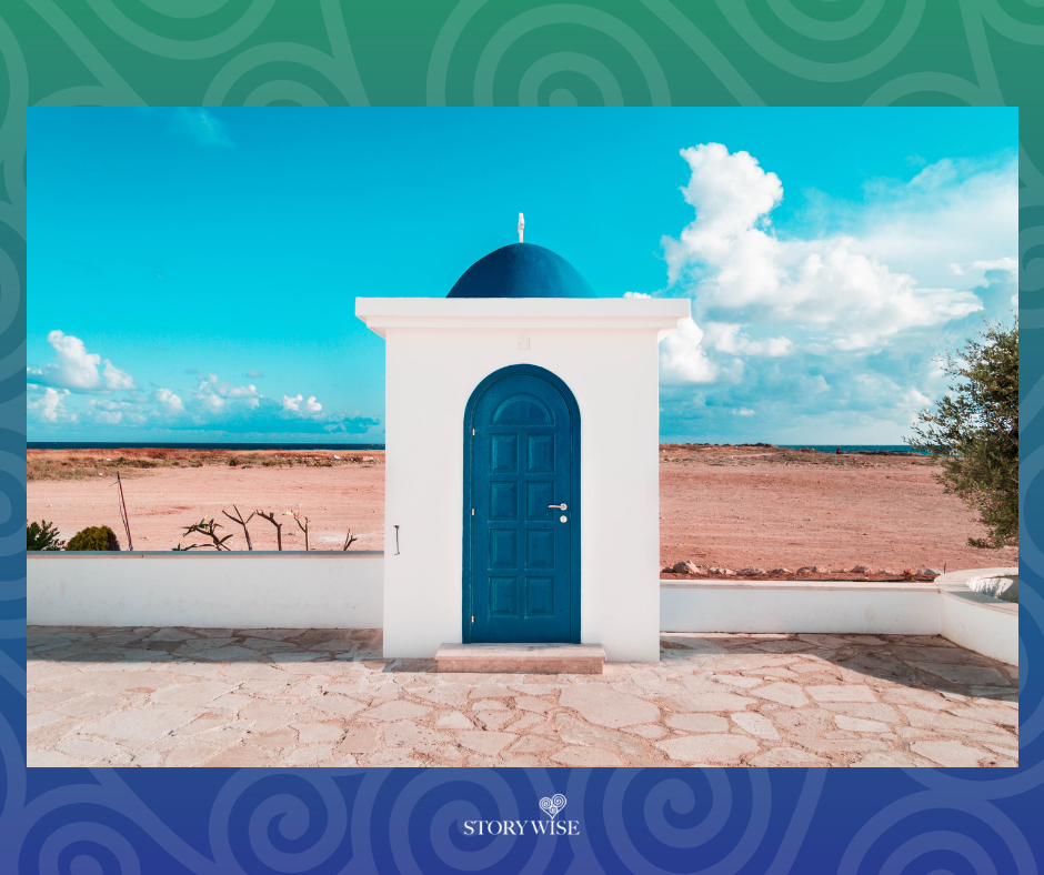  Blue door of white building in desert. 