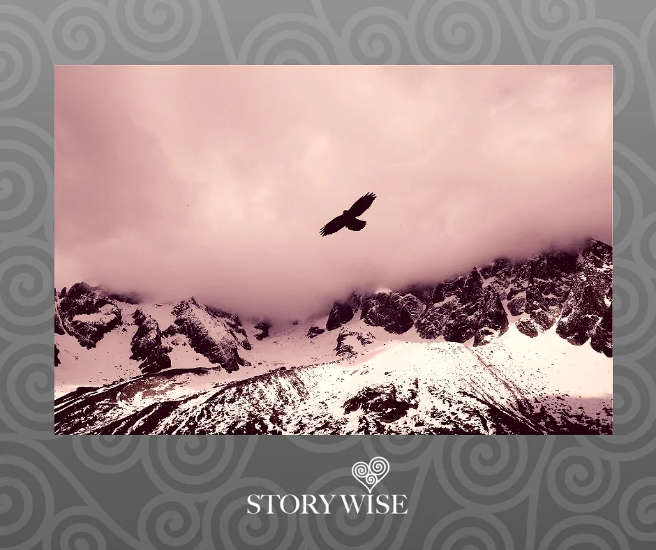 Eagle flying over high rocky snow topped mountains 