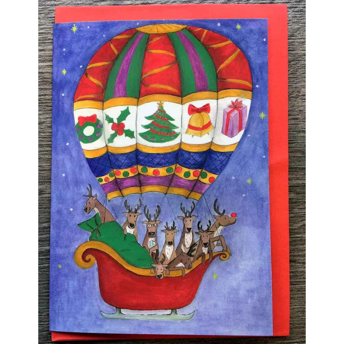 Squid Ink Art Christmas card of reindeers in hot air balloon