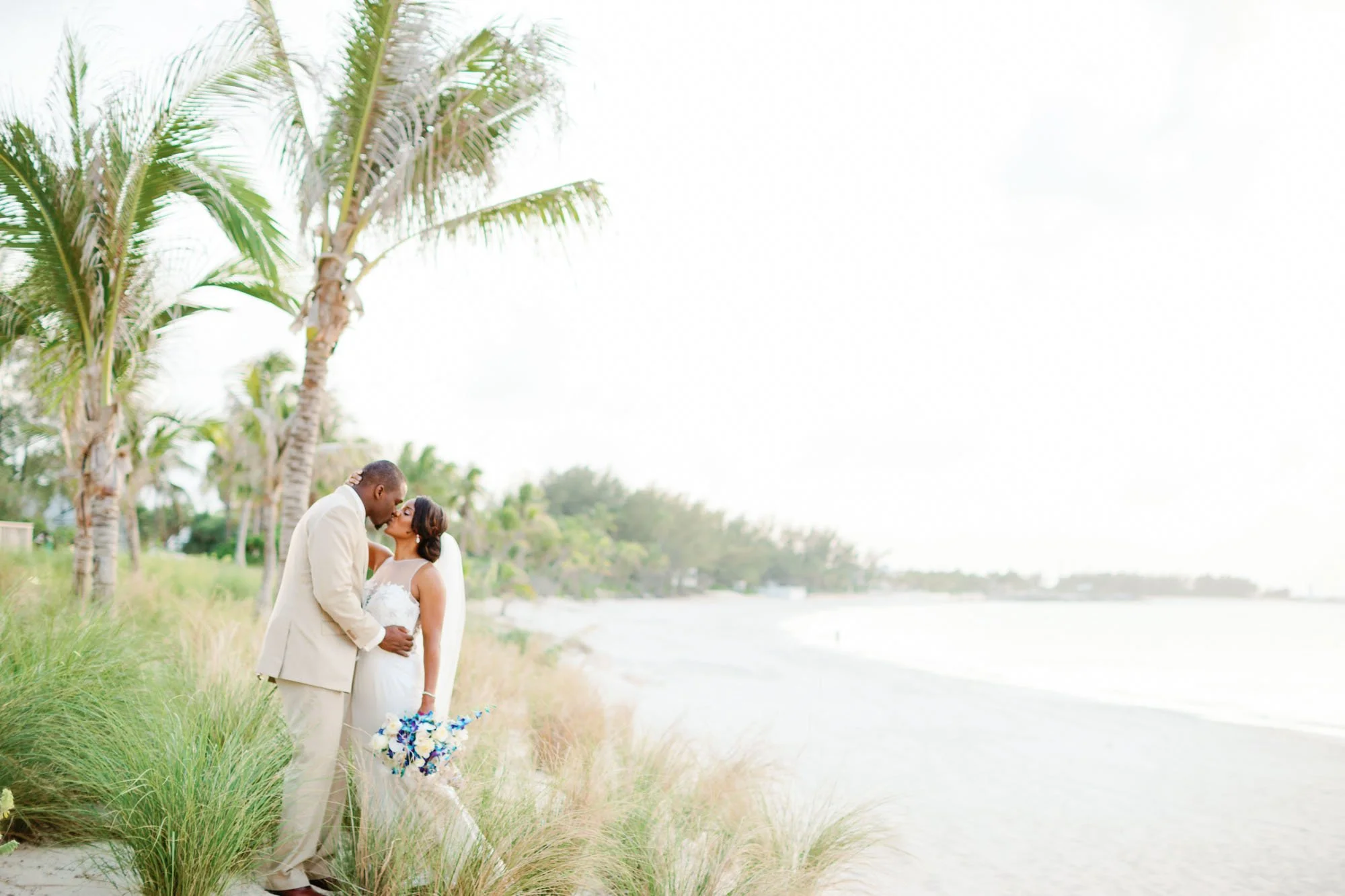 Seattle Seahawks Super Bowl champion Cliff Avril sharing a romantic beach moment with his bride Dantia in the Bahamas