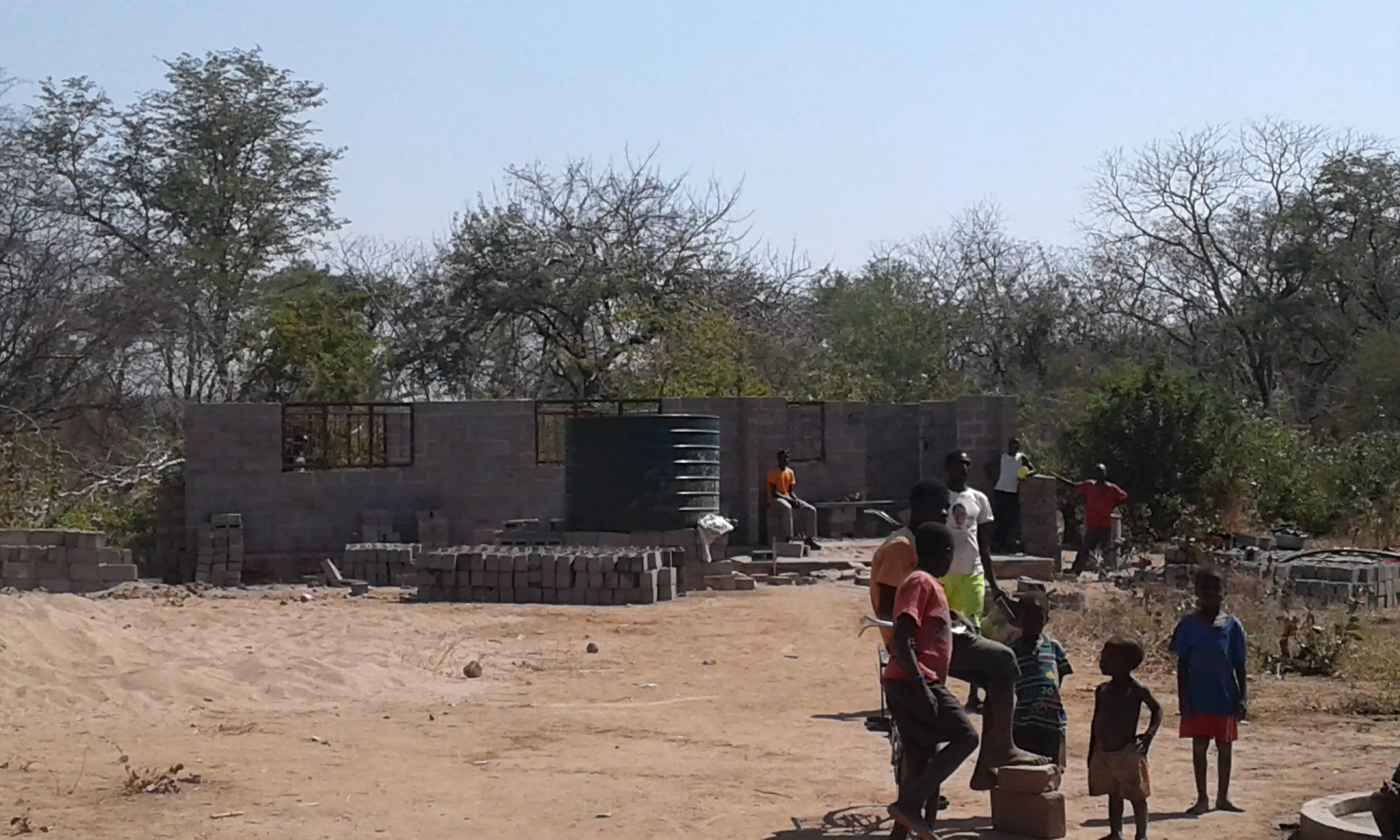 Tsoli tribal children at a well next to our school.