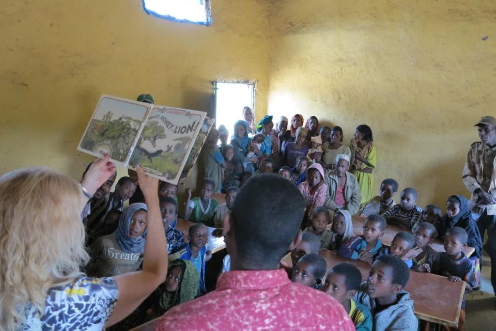  2018 Karen telling the story of the Honey guide bird and the Honey badger in Ambebaye school, Ethiopia. 