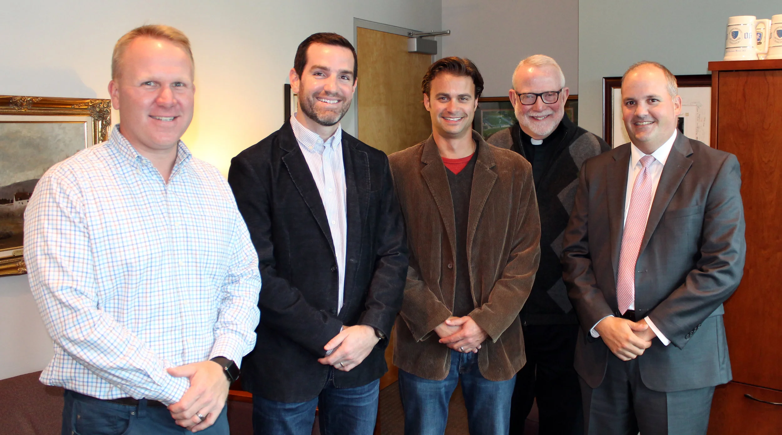 Rockhurst High School Check Presentation with Fr. Terrence Baum (2016)
