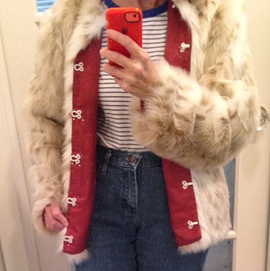 Covered hooks and eyes in process of hand sewing to jacket front. (some pins still visible.