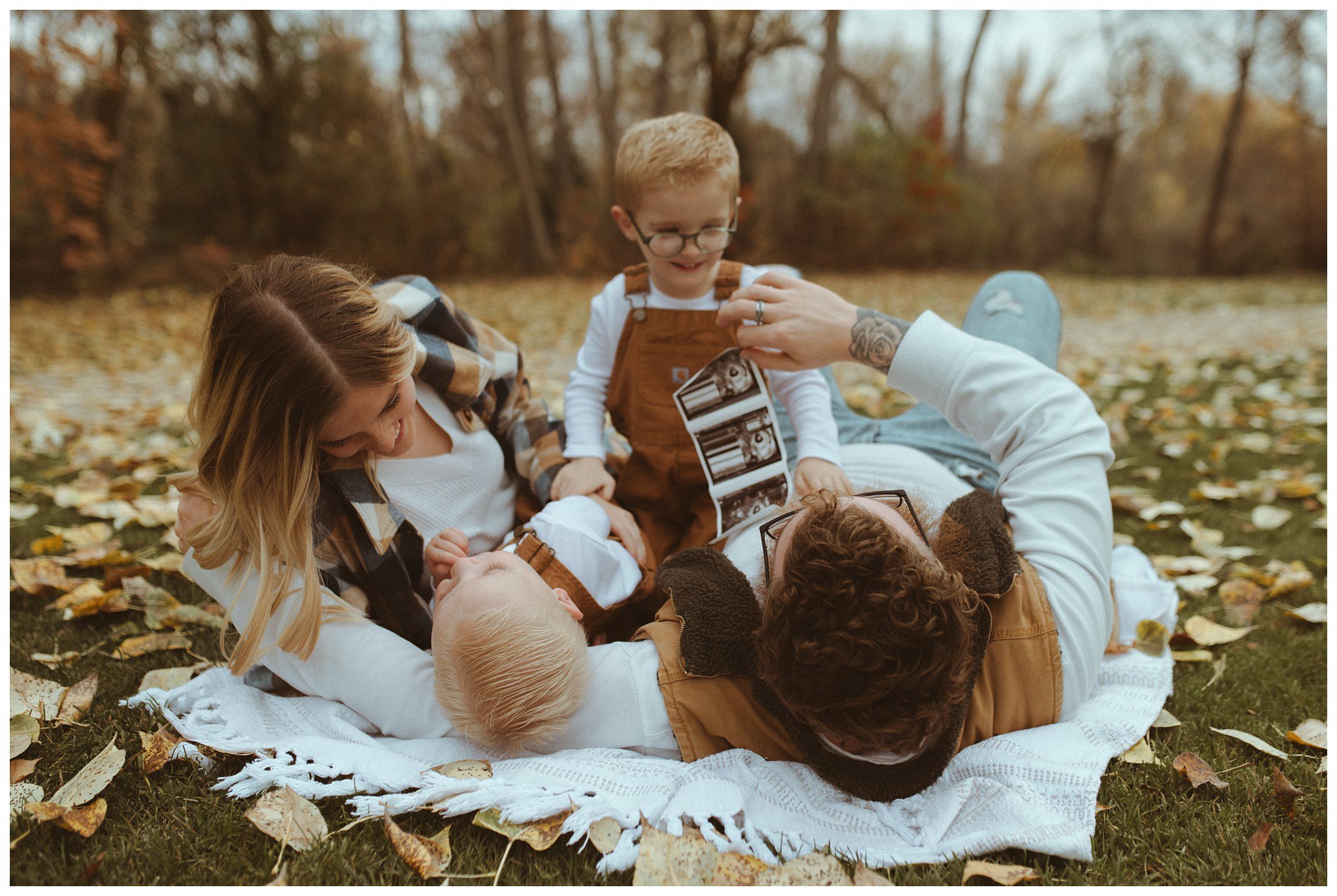 Black Family Fall Family Session and Pregnancy Announcement in Boise, ID at Idaho Fallen Firefighters Memorial Park