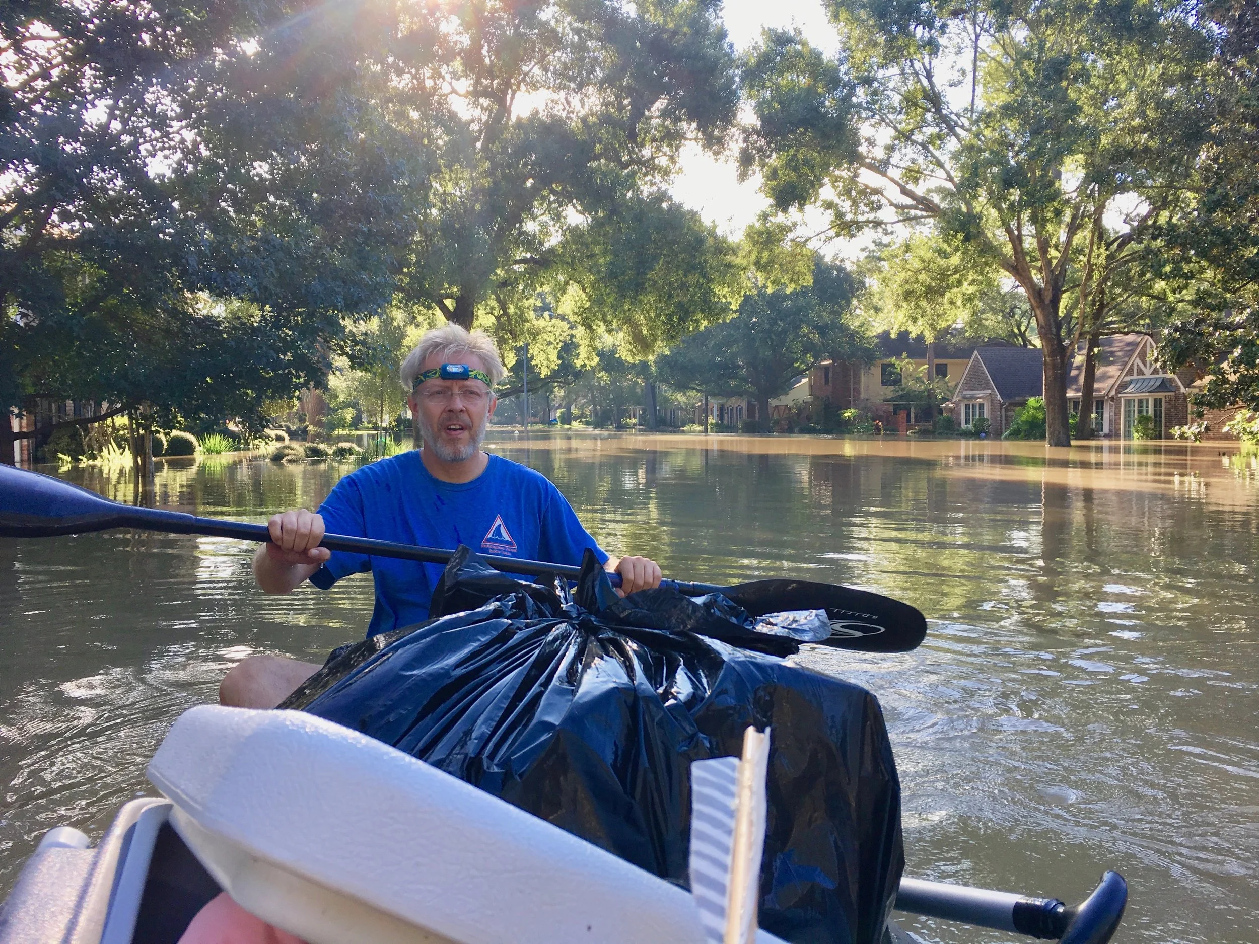 AlphaGlider client recovering personal items from his family's flooded home in Houston, September 2017