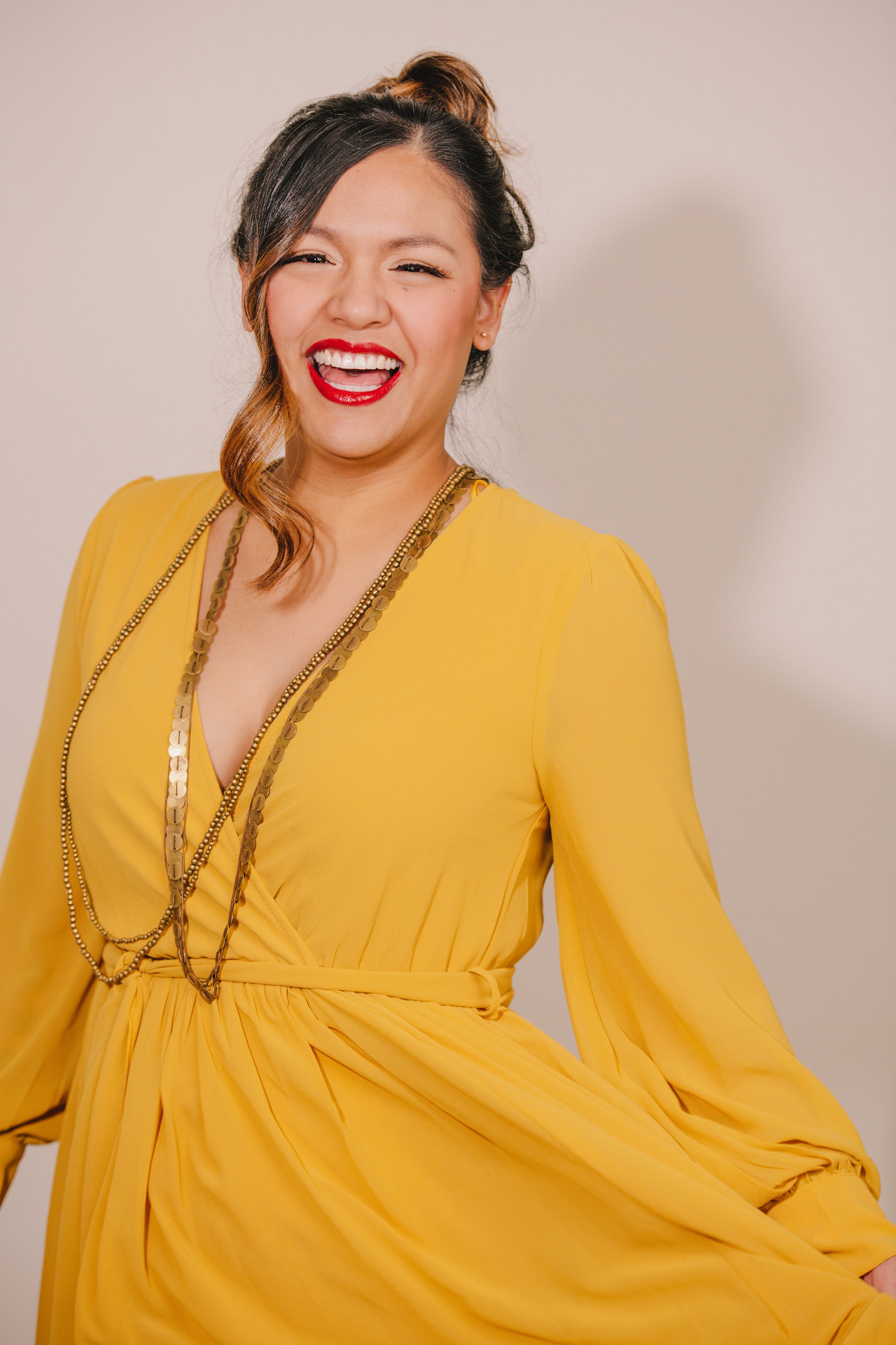 Bold Style Woman in Golden Yellow Dress Smiling Headshot Portrait