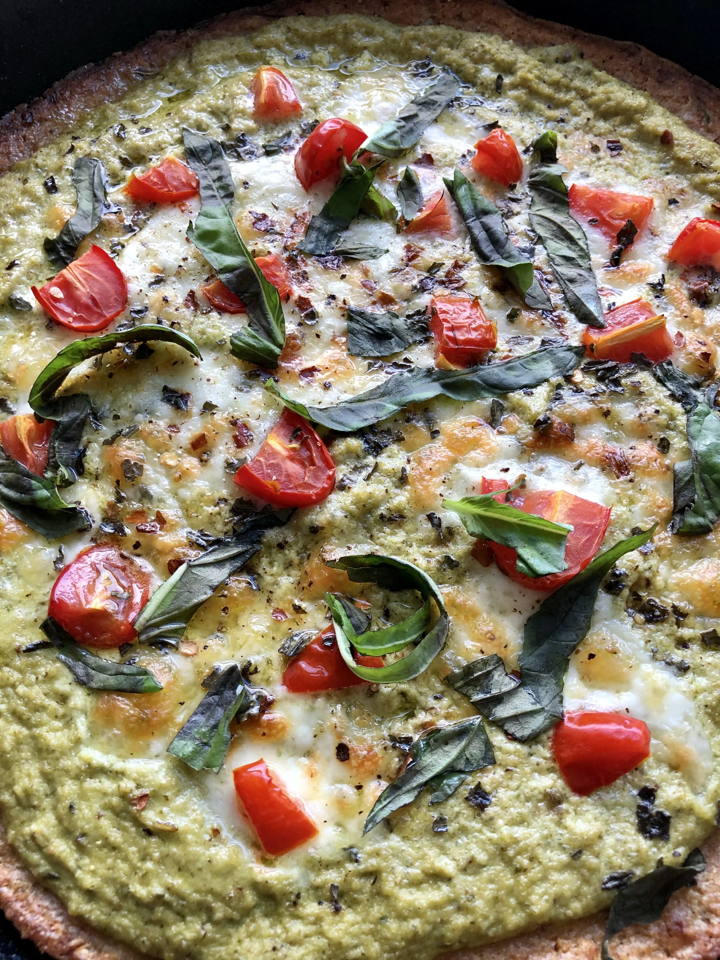 Cast Iron Cauliflower Pizza with Zucchini Pesto, Sheep's Milk Cheese and Cherry Tomatoes