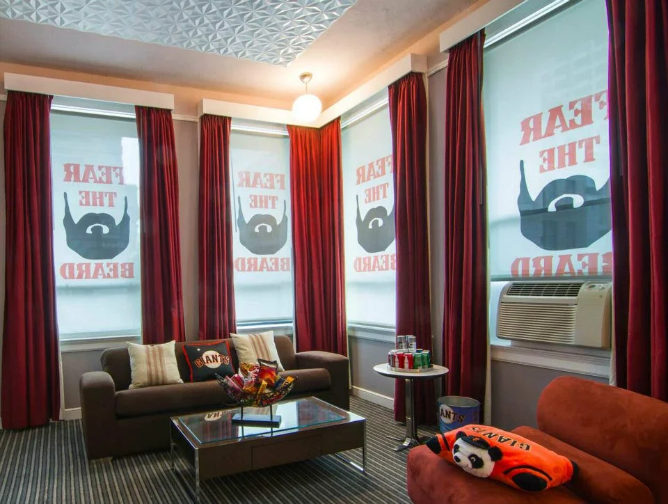 Custom printed roller blinds at Hotel Union Square in San Francisco. "Fear the Beard" during San Francisco Giants playoff run. Roller blinds were changed out seasonally with OrangePiel.