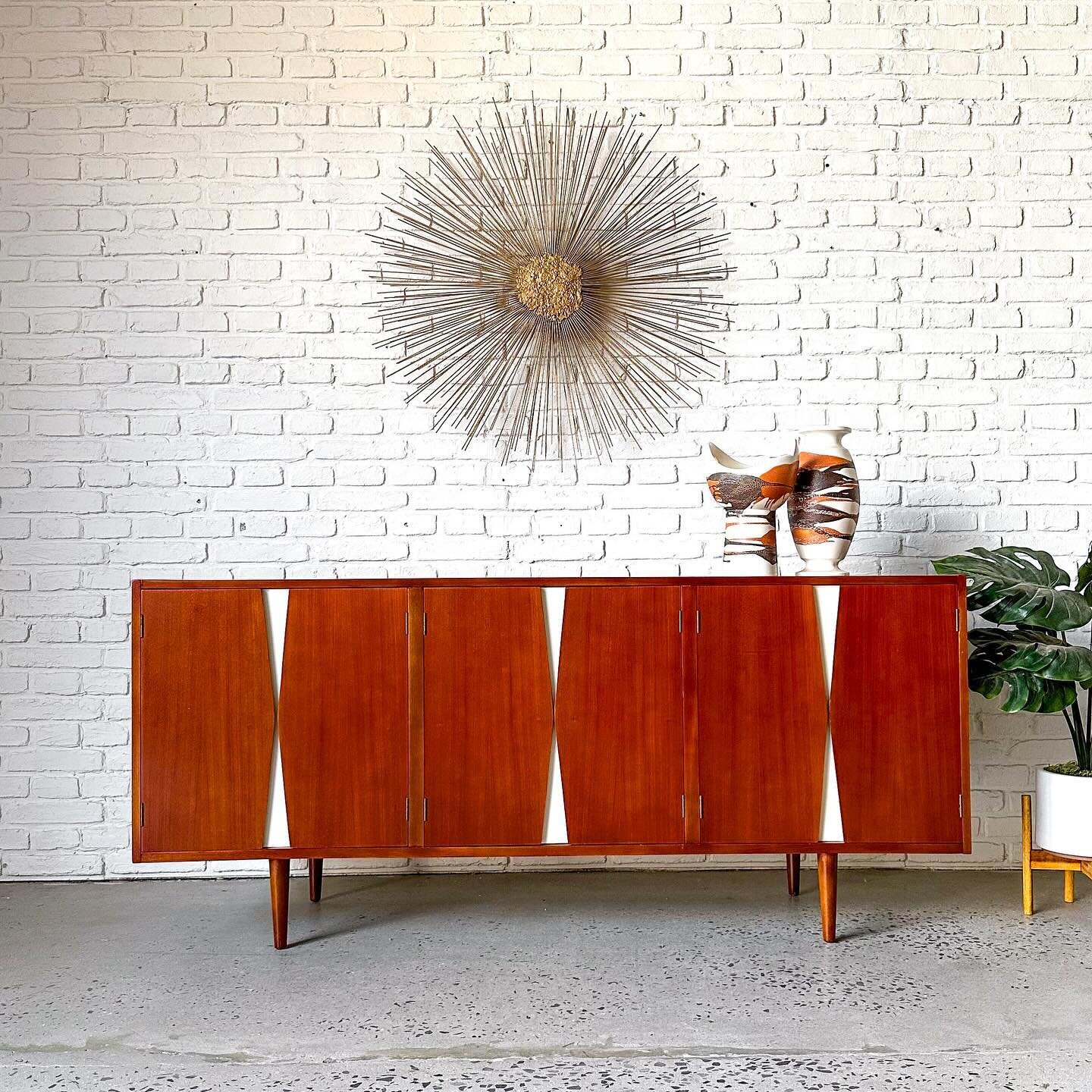 I don&rsquo;t know who made this, but I want to give them a high five. (Edit: it&rsquo;s American of Martinsville)

Completely refinished 1960s credenza, with that crazy good hourglass design built into the doors, which doubles as the pulls. Drawers 
