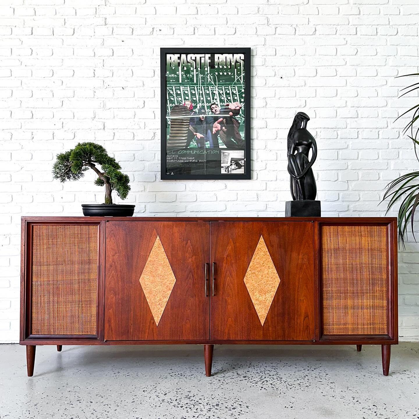 This has a pair of really nice built in speakers, so you can hook up your receiver and turntable and get the party started. 

1960s mid century modern walnut record cabinet.  Room for some records, components, or whatever else you need to stash. Refi