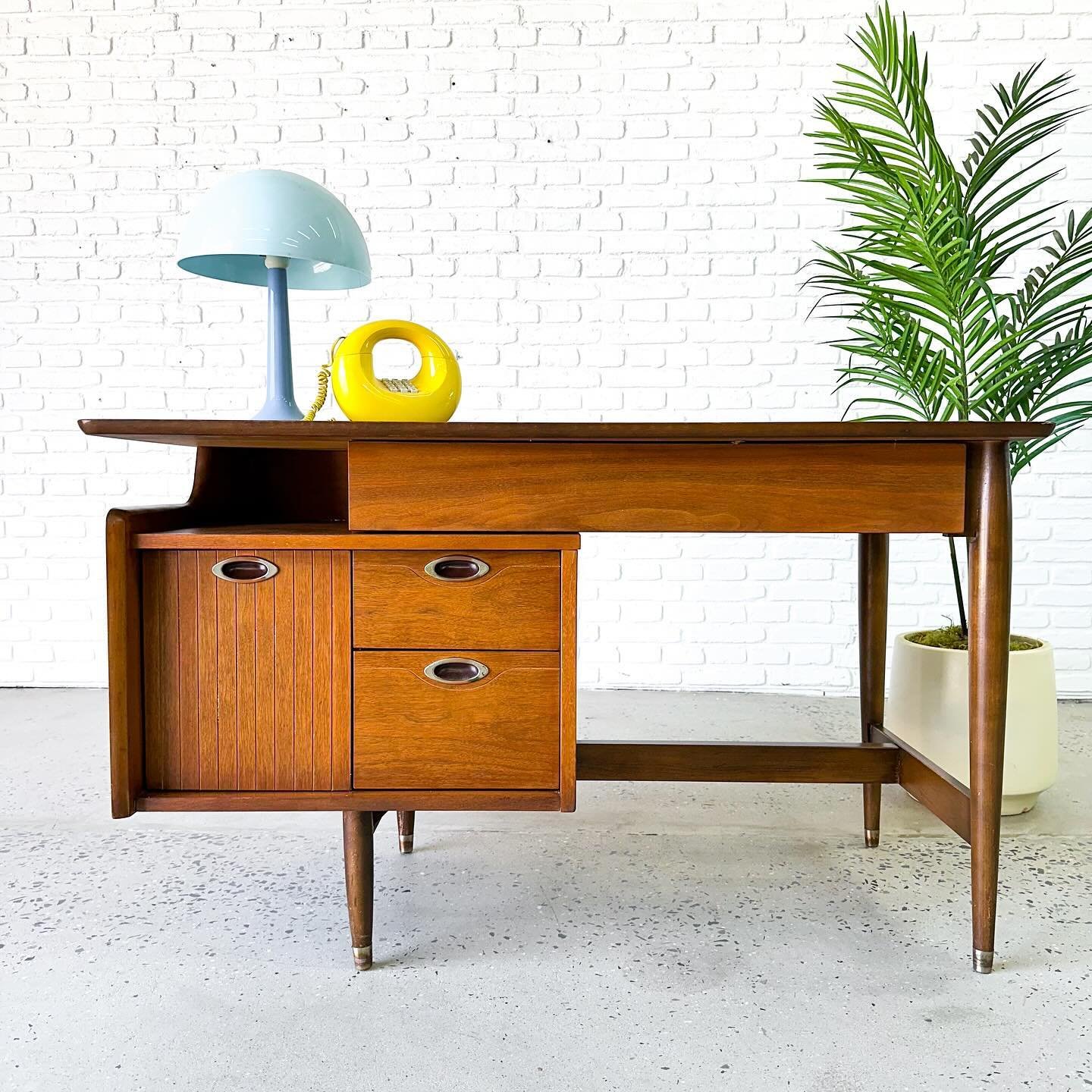 Insert &ldquo;Hooker&rdquo; joke here. 

That&rsquo;s right, this is a Mainline by Hooker walnut desk from the 1960s. Top has been refinished. Great design with a decent work surface. 

49&rdquo; x 25&rdquo; x 29.5&rdquo; tall 
Leg clearance: 20.5&rd