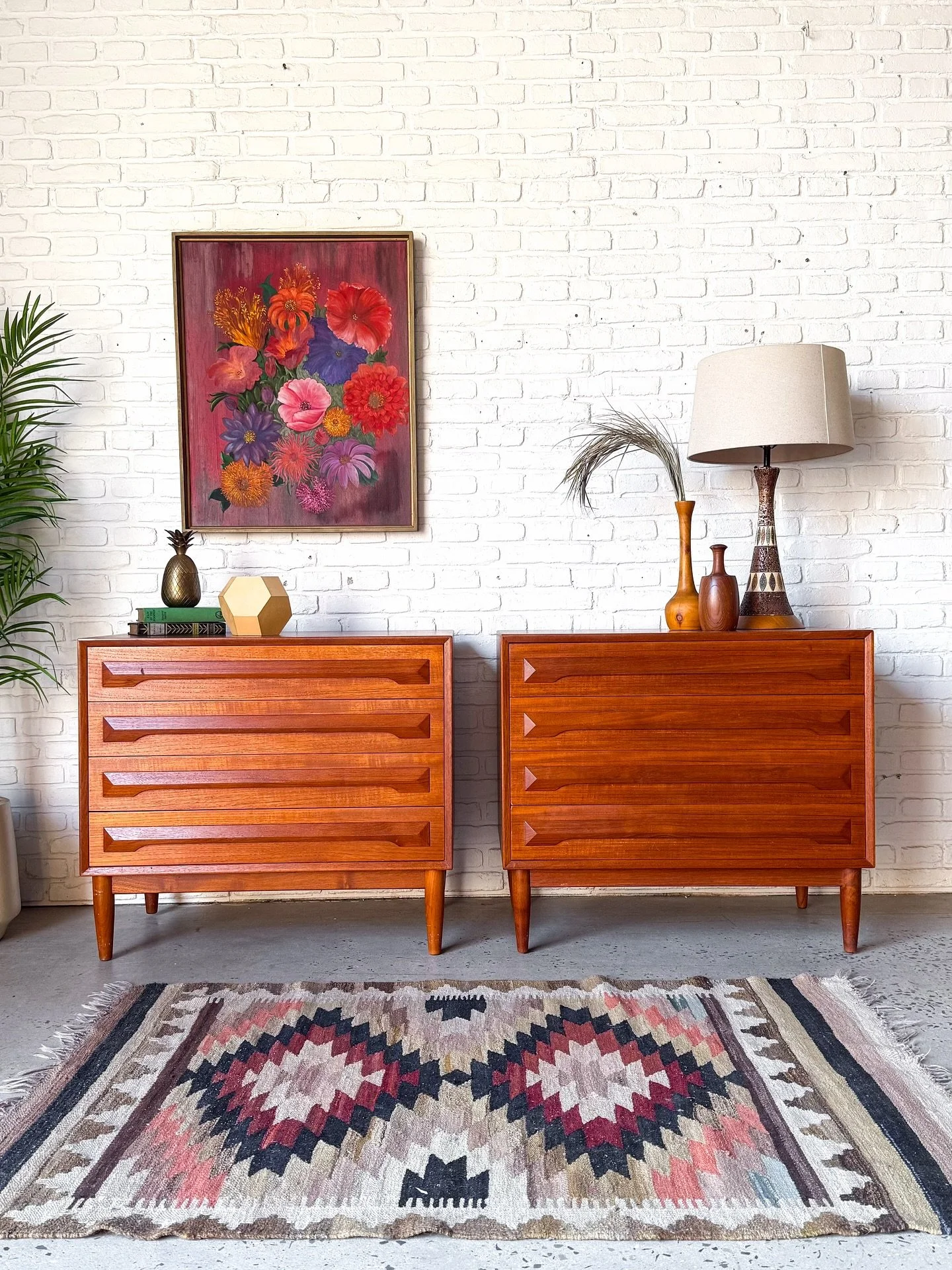 Matching pair of teak four drawer dressers, made in Denmark by Ib Kofod Larsen. Lovely angular pulls, built right into the solid wood dovetail drawers. Top notch quality on this beautiful pair from the 60s.
Good original condition with minor signs o