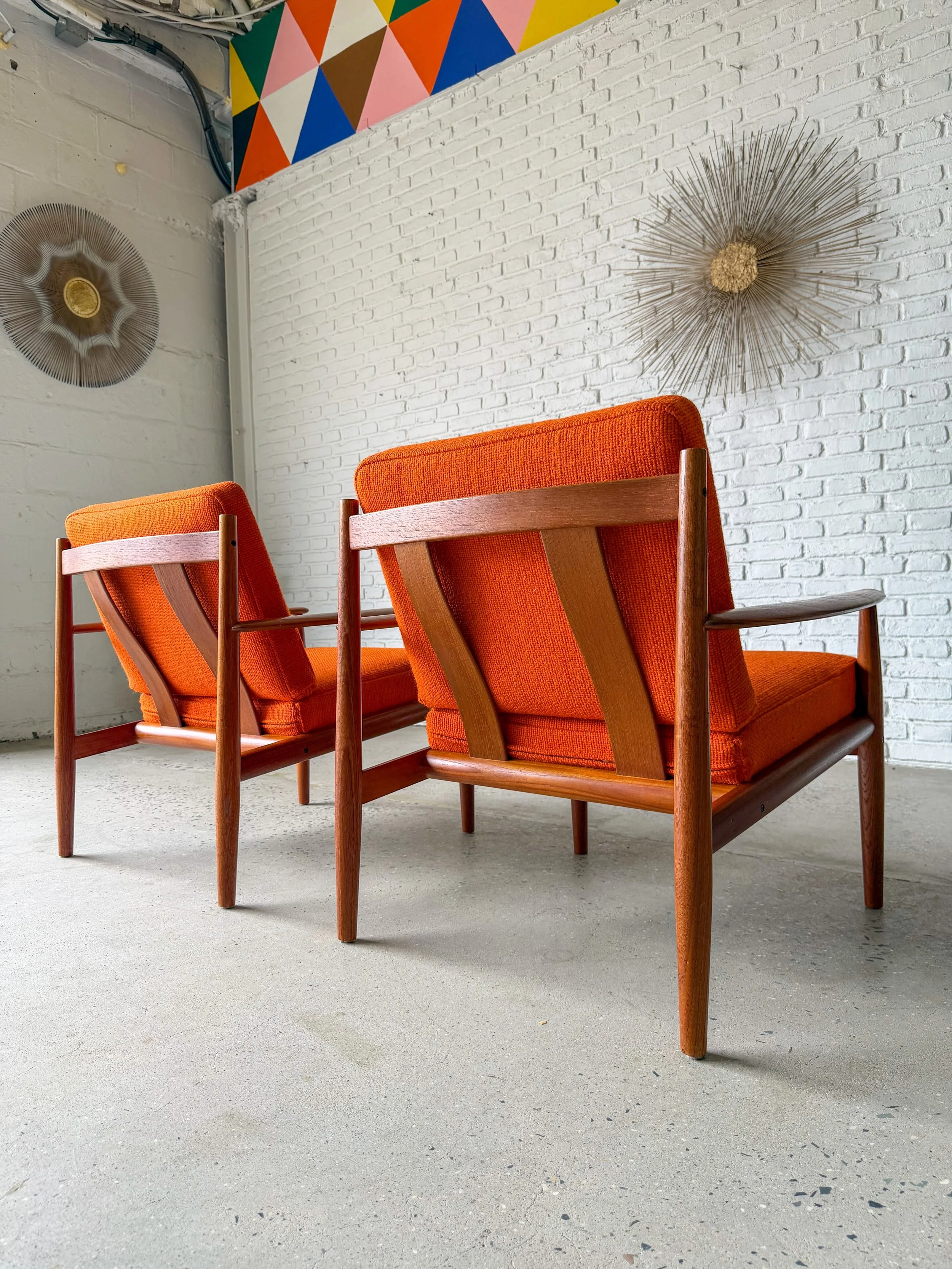 Fabulous quality solid teak lounge chairs, Designed by Grete Jalk for France and Son in Denmark. Imported to the US by John Stewart in NYC. 

Comes with original spring-loaded orange cushions. Beautiful condition. 

$2000 each

30.5&rdquo; deep &time