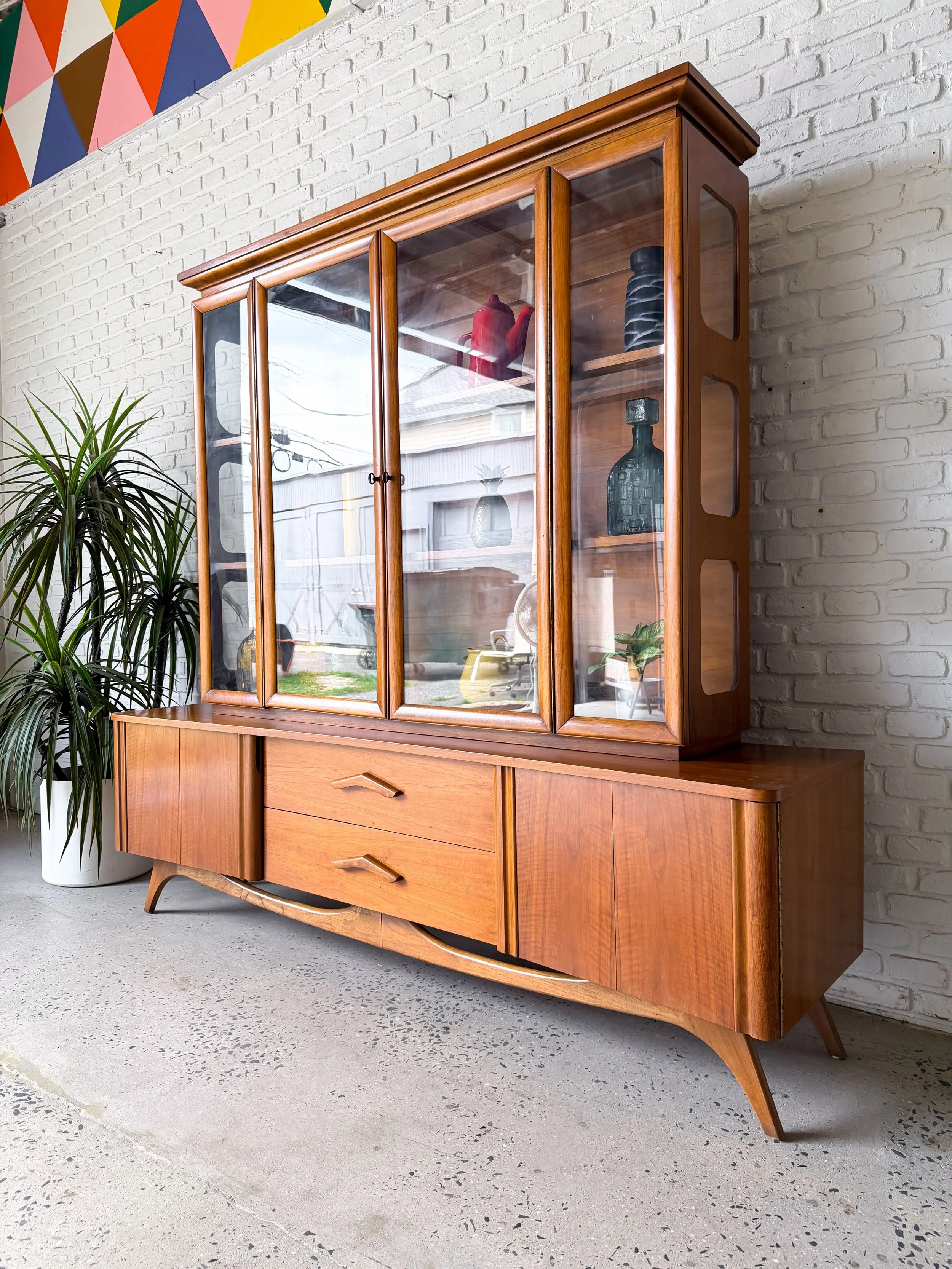 A dramatic hutch indeed. 

Two piece walnut hutch, made in North Carolina by Young Mfg in the 1960s. Lots of room for hidden storage, and plenty of space to display your cool little things. 

78&rdquo; x 19&rdquo; x 74&rdquo; tall overall

$2500

#mi
