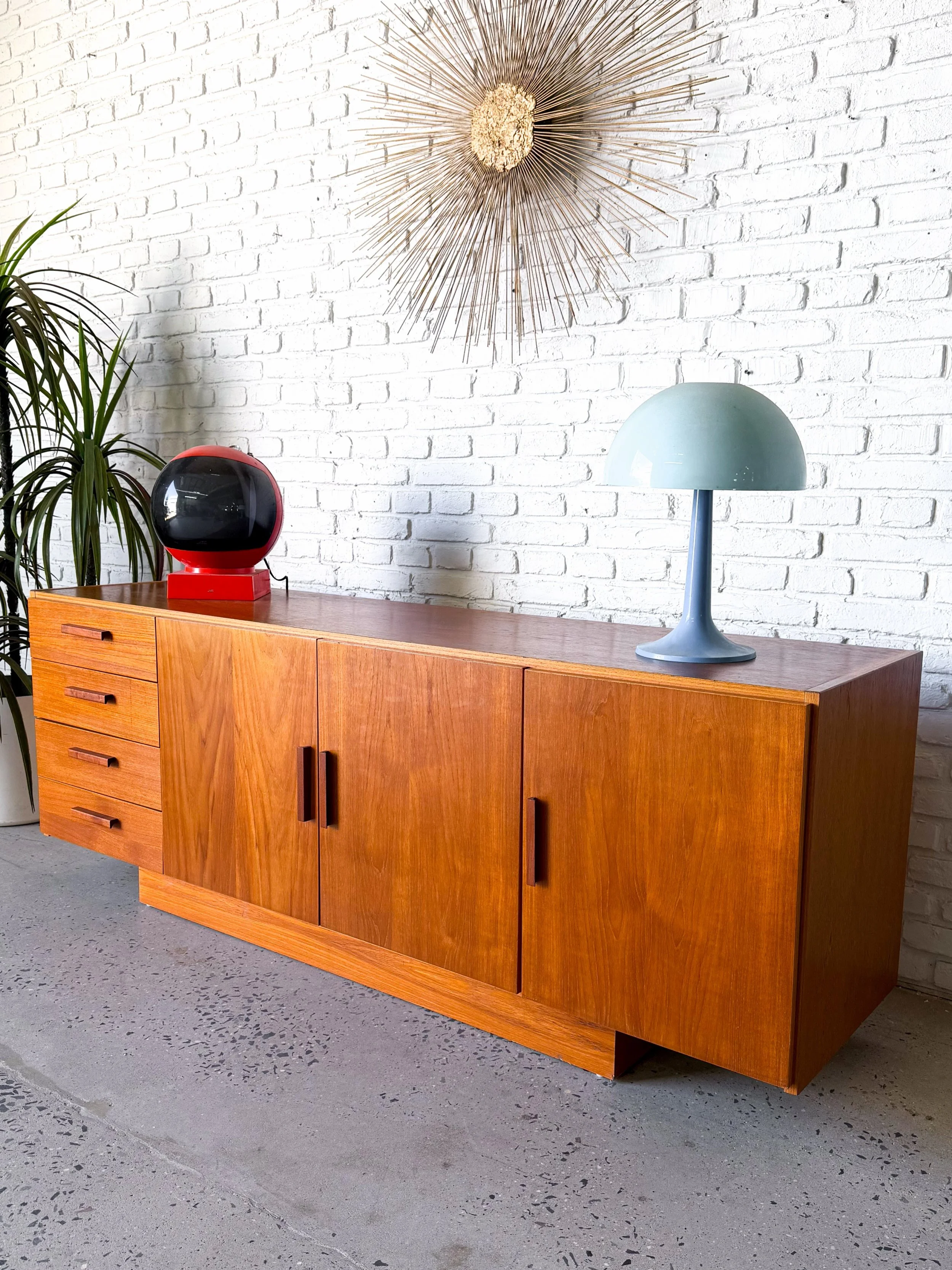 Teak Danish modern media center credenza, made in Denmark by Faarup Mobelfabrik. Four large storage drawers, and adjustable shelves. Fits records! And has wire holes in the back. 

71.25&rdquo; x 18.25&rdquo; x 27&rdquo; tall

$1400

#faarup #danishm