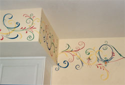 A family room with a 10-foot ceiling, in Olney, MD, is treated to flourishes around the perimeter of the room in 4 colors.