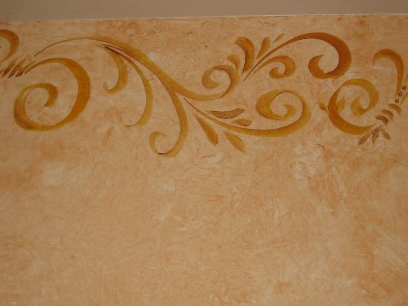 A faux finish and flourishes grace a powder room.