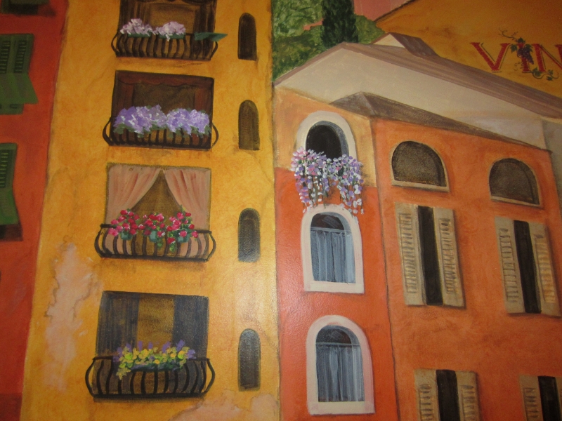 "Show the aged walls, the paintings on walls, the flowers trailing from balcony boxes..."
