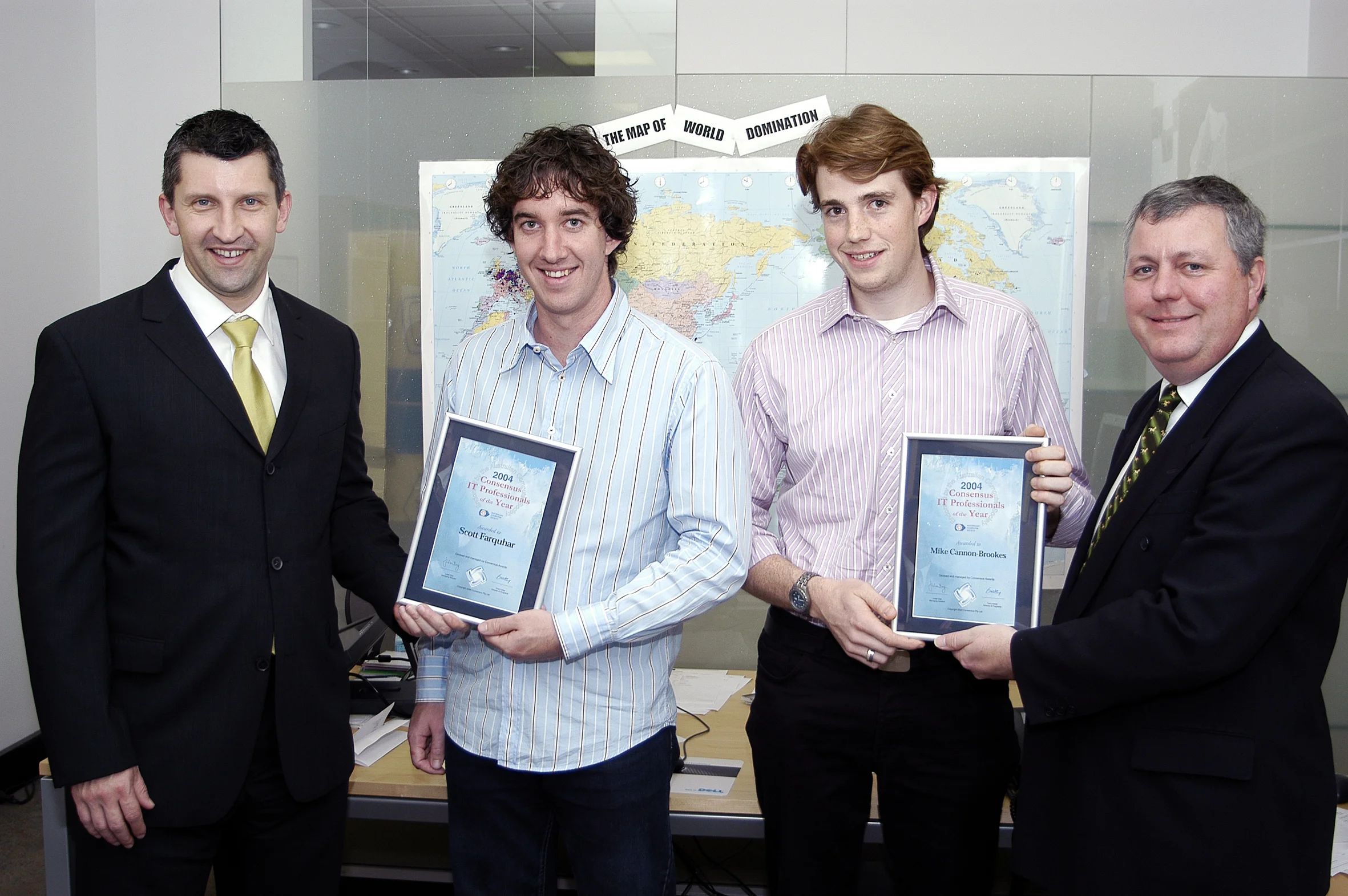 Mike Cannon-Brookes and Scott Farquhar, founders of Atlassian in the early days (Note the map of world domination in the background)