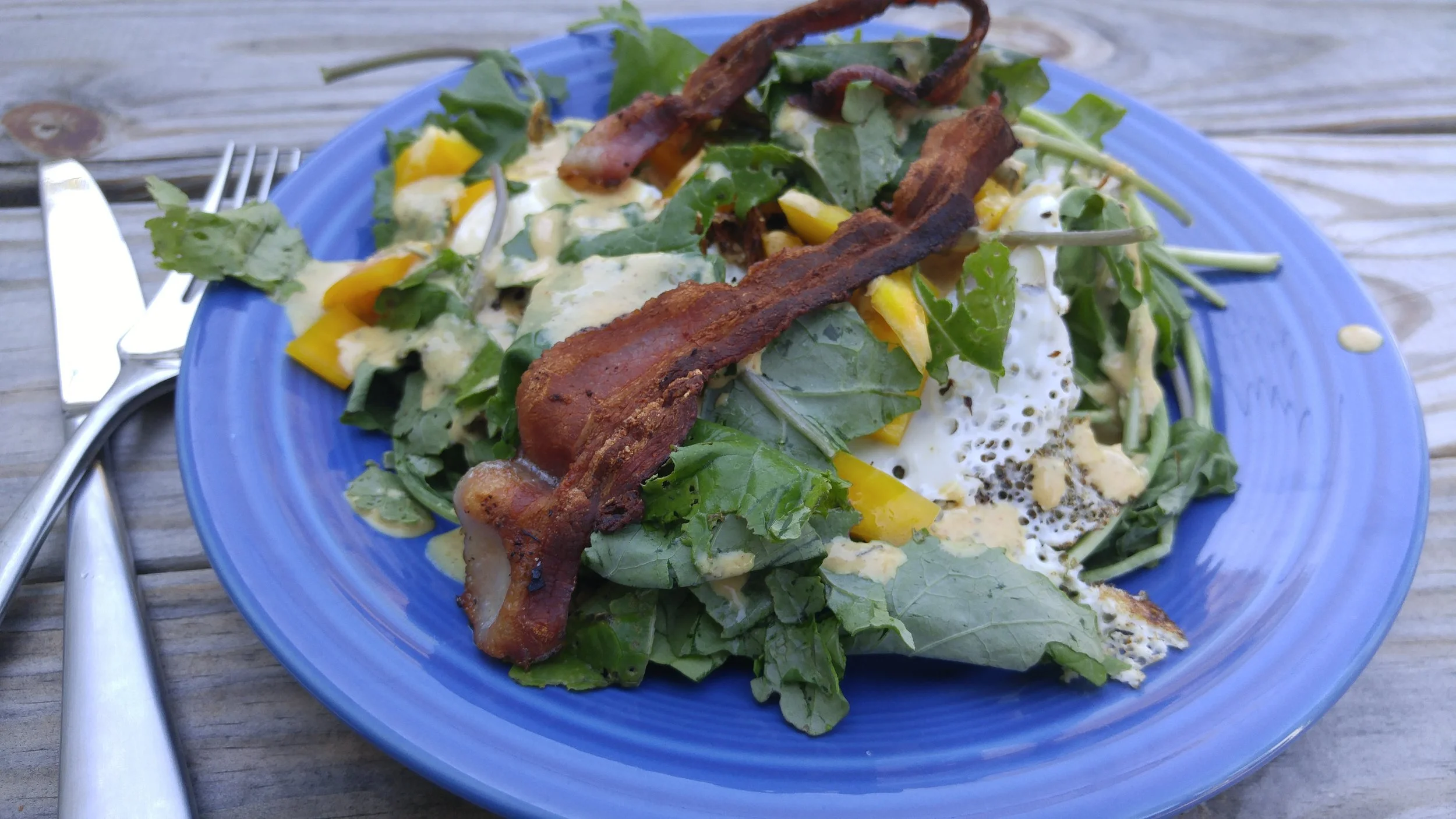100% local, farmers-market sourced salad with bacon leftover from the weekend, fresh yellow bell pepper, kale, and an egg over-easy. I swear, this isn't difficult!