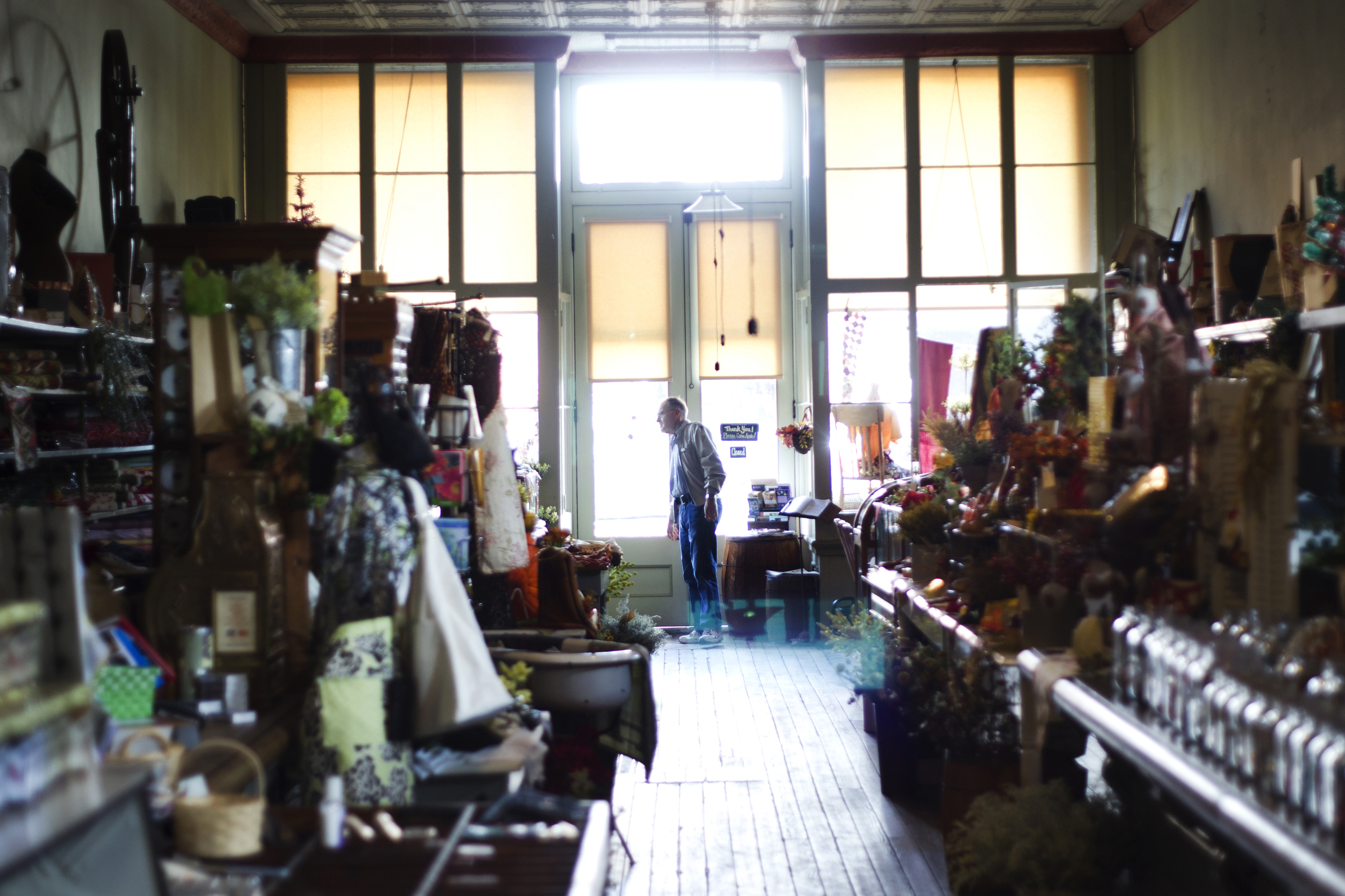  A customer browses through Beeker's General Store, a longtime fixture in downtown Pemverville, Ohio. As Election Day nears, residents are weighing the issues that matter to them.  