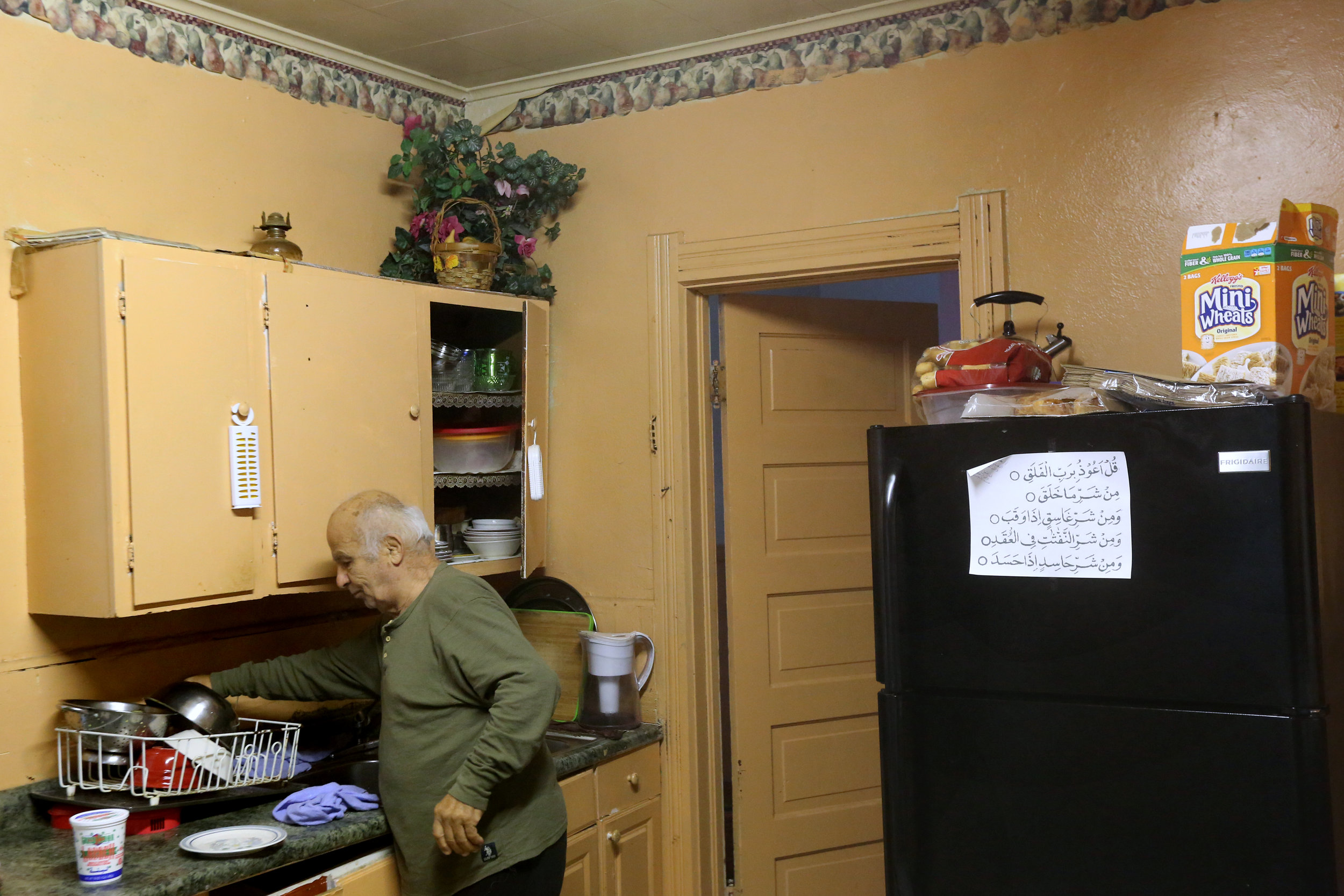  Hassan Cheaib, 81, cooks breakfast in his home in Toledo's North End. My Cheaib, who is proud to own his home outright, says the neighborhood's low cost of living is a plus. His wife, Khadije, posts Qur'anic Arabic verses throughout their house. 



