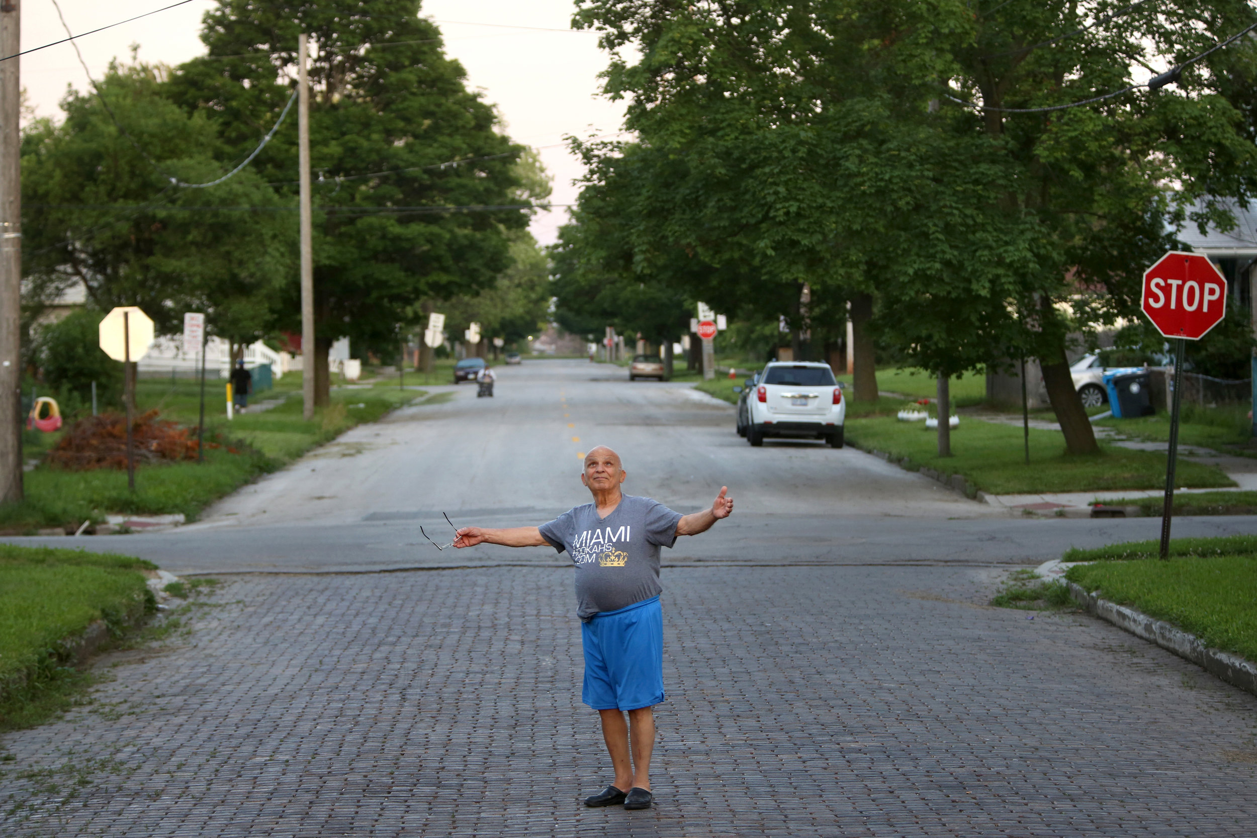  "God is everywhere," Hassan Cheaib, 81, said as he stood in the road for a photograph near his home in Toledo's North End. Mr. Cheaib is a vocal advocate of the neighborhood. He emigrated from Lebanon to Dearborn, Mich., in 1961 and then moved to To