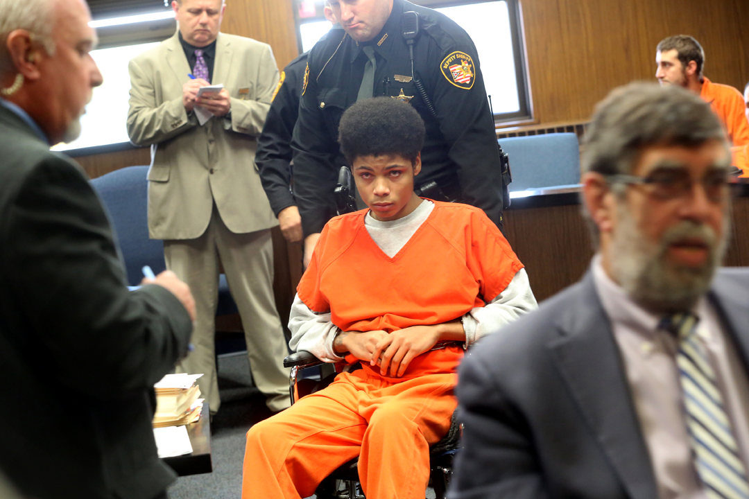 Devonte Brown, then 16, is wheeled out of the courtroom after being arranged before Lucas County Common Pleas Judge Ian English on Oct. 8, 2015, on two counts of aggravated murder, one count of attempted murder, and other charges for stabbing to dea