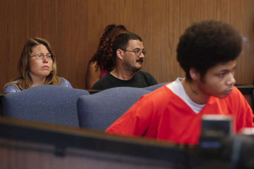  Josianne Thomas, left, and her husband Mike Thomas, center, are stoic at the plea agreement hearing for Devonte Brown, 17, right, on June 3, 2016, before Lucas County Common Pleas Judge Ian English. Brown entered an Alford plea and was found guilty 
