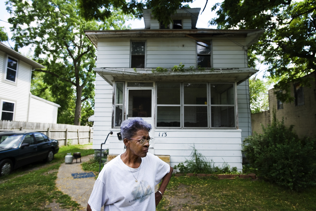  Annie Osborne stands in front of the house she has called home for more years than she can remember. Osborne lost her home to tax foreclosure after being unable to pay her taxes for two years. Though Jackson County officially took possession of her 