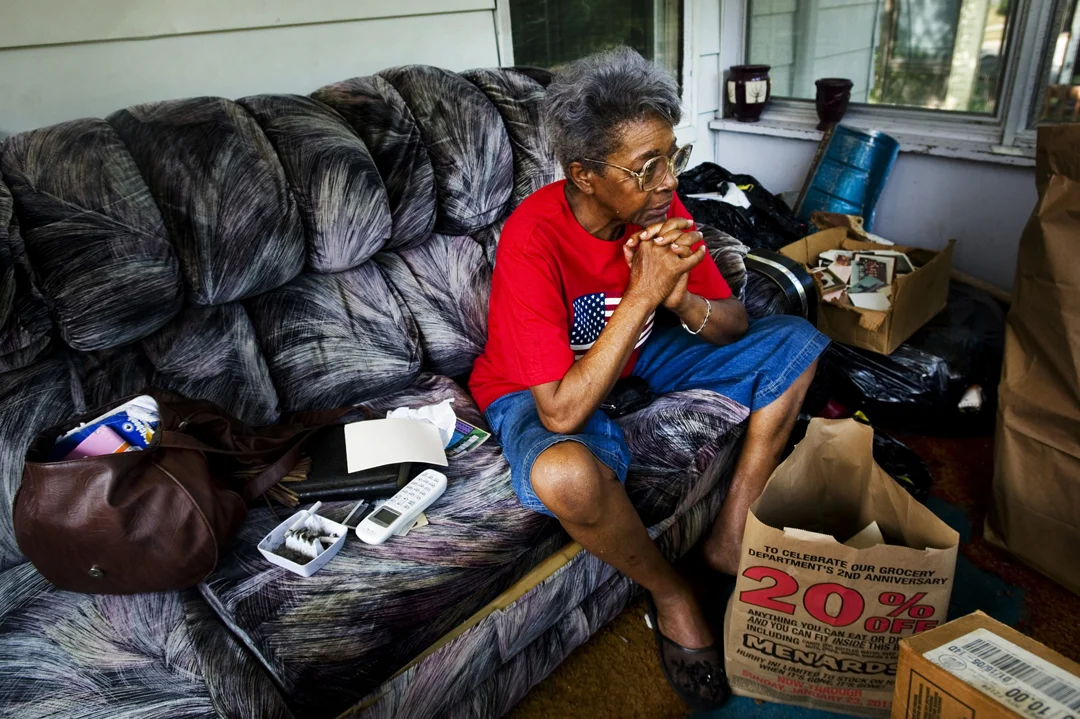  Annie Osborne sits on her porch contemplating her next move as the clock winds down toward the deadline for her to be out of the property. Osborne had been given an extension on her eviction though the weekend to move out of the home that has been i