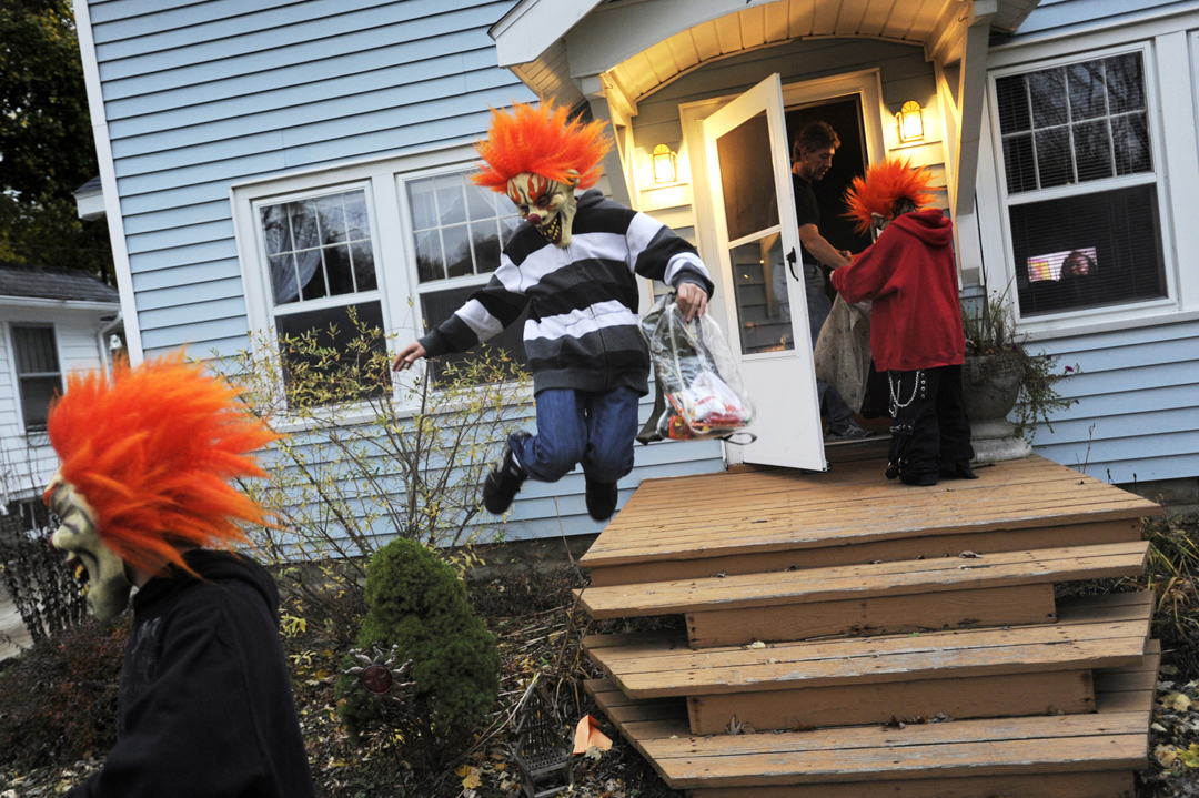  Chris, 14, and Nikolus Johnston, 12, center, make the trick-or-treat rounds with their friend Jared Dionne, 13, right, on Halloween in Jackson. The three are dressed as Juggalos, as the fans of the music group Insane Clown Posse are known. "We're al