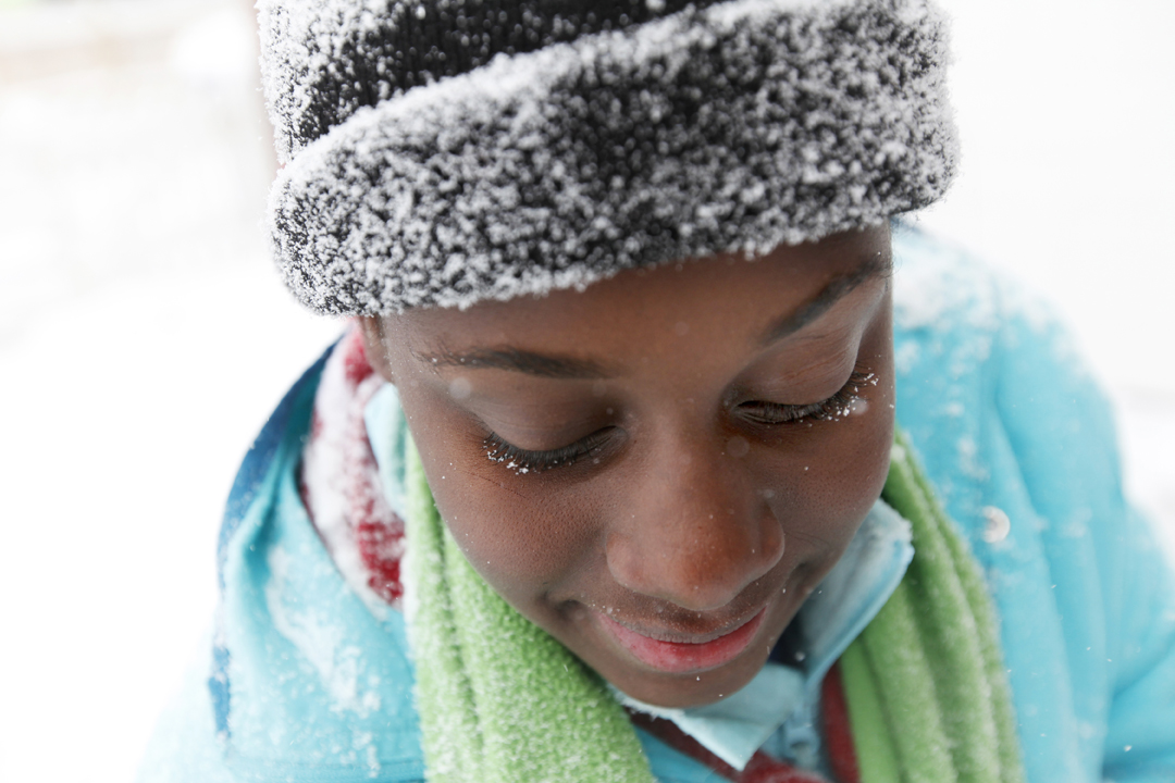  Latara Walker, 12, lends her shovel to the effort to clear the driveway of her cousin's home as falling snow gathers on her eyelids in West Toledo. Snow fall from early Wednesday, Jan. 1, 2014, through 1 p.m. of Thursday, Jan. 2, 2014, totaled 9.1 i