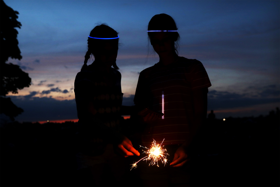  Maddie O'Dell, 13, left, and Sophie Twigg, 13, light their sparklers before the start of this year's fireworks display Monday, July 3, 2017, at Fort Meigs in Perrysburg. Thousands of area residents turned out on both sides of the Maumee River to wat