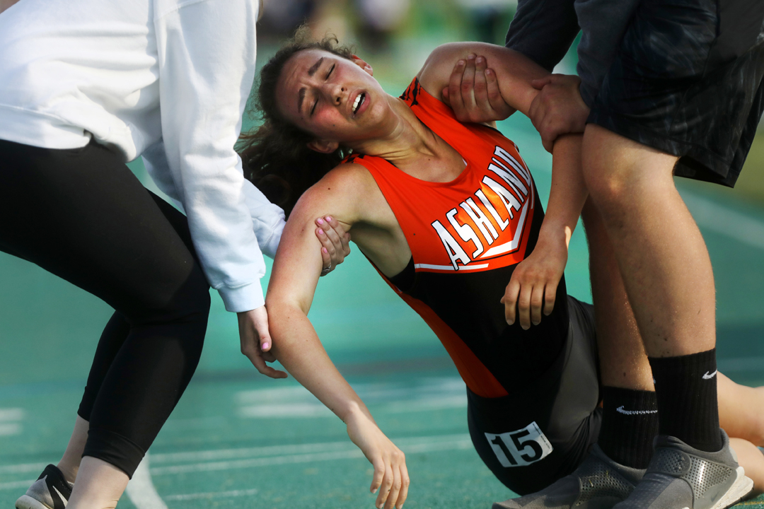  Ashland's Healther Jamieson is carried off the track after collapsing at the finish line of the 1600 Meter Run at the Division 1 Region 2 Track and Field Championship meet Friday, May 26, 2017, at Amherst Steele High School. 





 