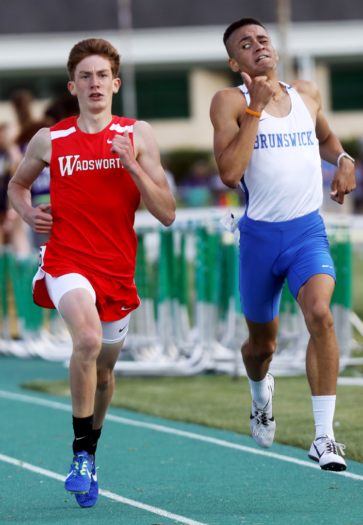  Brunswick's Andre Bollam-Godbot, right, keeps an eye on the Brunswick's Game Szalay in the 1600 Meter Run at the Division I Region II Track and Field Championship meet Friday, May 26, 2017, at Amherst Steele High School.  