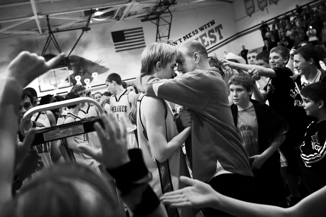  Vandercook Lake's senior Chad Marriott is congratulated by his coach after his team's win of Thursday night's home game against East Jackson. The Jayhawks were able to overcome an early deficit to pull ahead and win a share of the Cascades Conferenc