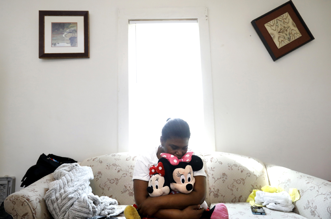 "She was our oxygen," Kendra Hunter, 40, said as she clutched Minnie Mouse dolls belonging to her granddaughter Serenity Hunter, 1, who died April 4, 2018, after allegedly being hit and thrown into the couch, pictured, at her home in Toledo. Joshua Herron, 30, the boyfriend of Serenity's mother, is charged with the murder. Prosecutors allege Herron was responsible for Serenity's fatal injures when he was watching the toddler alone on Easter Sunday. Serenity's homicide is the third case in 2018 where a mother's partner is charged with killing a young child.