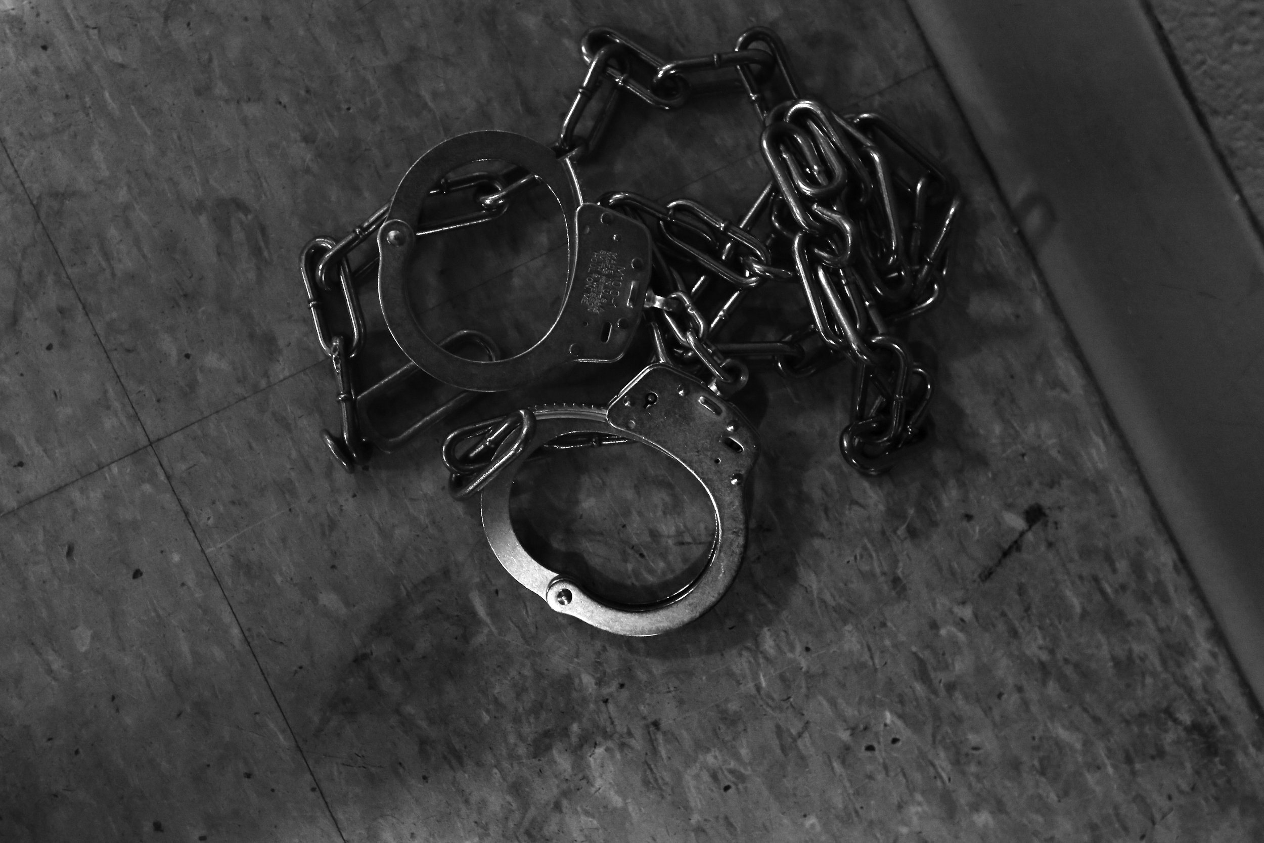  A pair of cuffs sits over bloodied linoleum tile in the control room of the booking area at the Lucas County Jail in downtown Toledo on Jan. 23, 2014.  