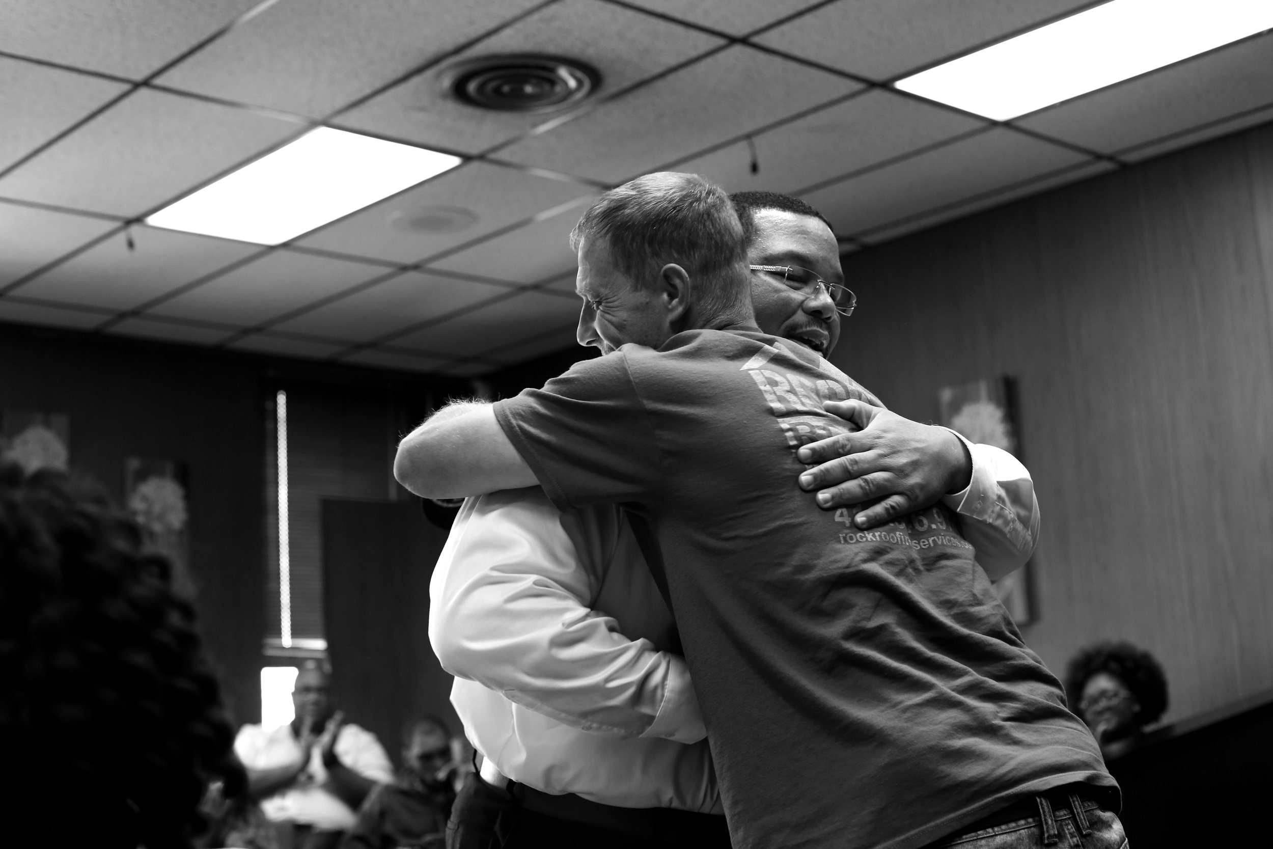  Lucas County Common Pleas Judge Ian English, left, embraces Jimmie Vallier after they met during a session of drug court in Toledo, Ohio, on June 28, 2017. Toledo's drug court, created in response to the rising opioid epidemic, was wrapping up its f