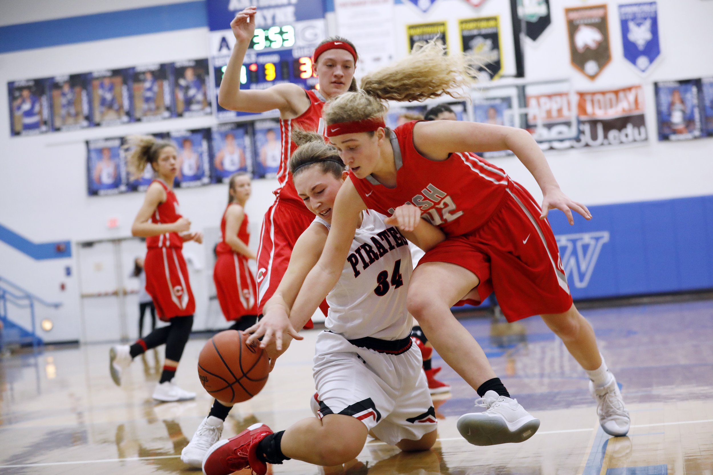  Perkins' Maria Schoder (34) and Central Catholic's Maverick Delp dive for a loose ball in the OHSAA Division II Northwest District Semifinal matchup at Anthony Wayne High School in Toledo on March 1, 2018. Perkins won, 49-42. 