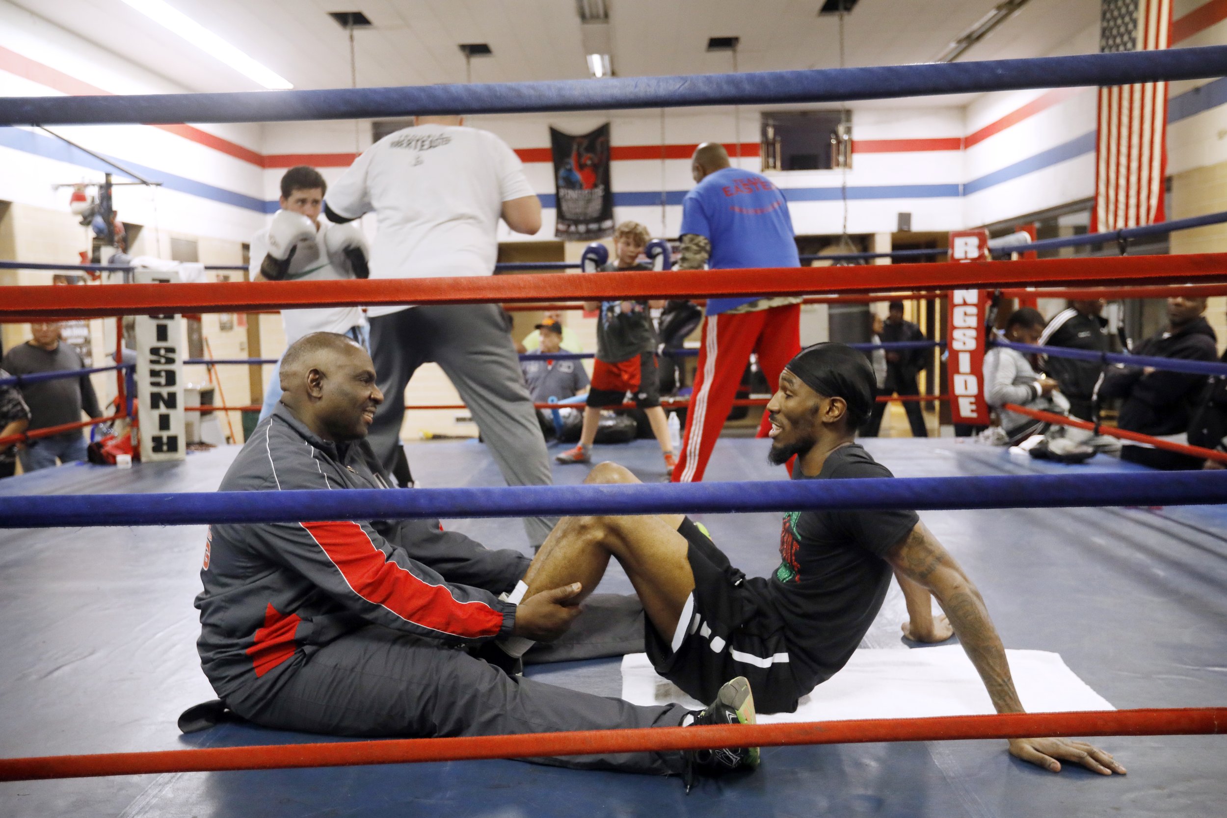  Young boxers practice as Robert Easter, Jr., bottom right, talks with assistant coach Michael Stafford during a work-out at Glass City Boxing Gym in Toledo, Ohio, on Jan. 9, 2018. Easter, the IBF lightweight champion, still works out in his neighbor