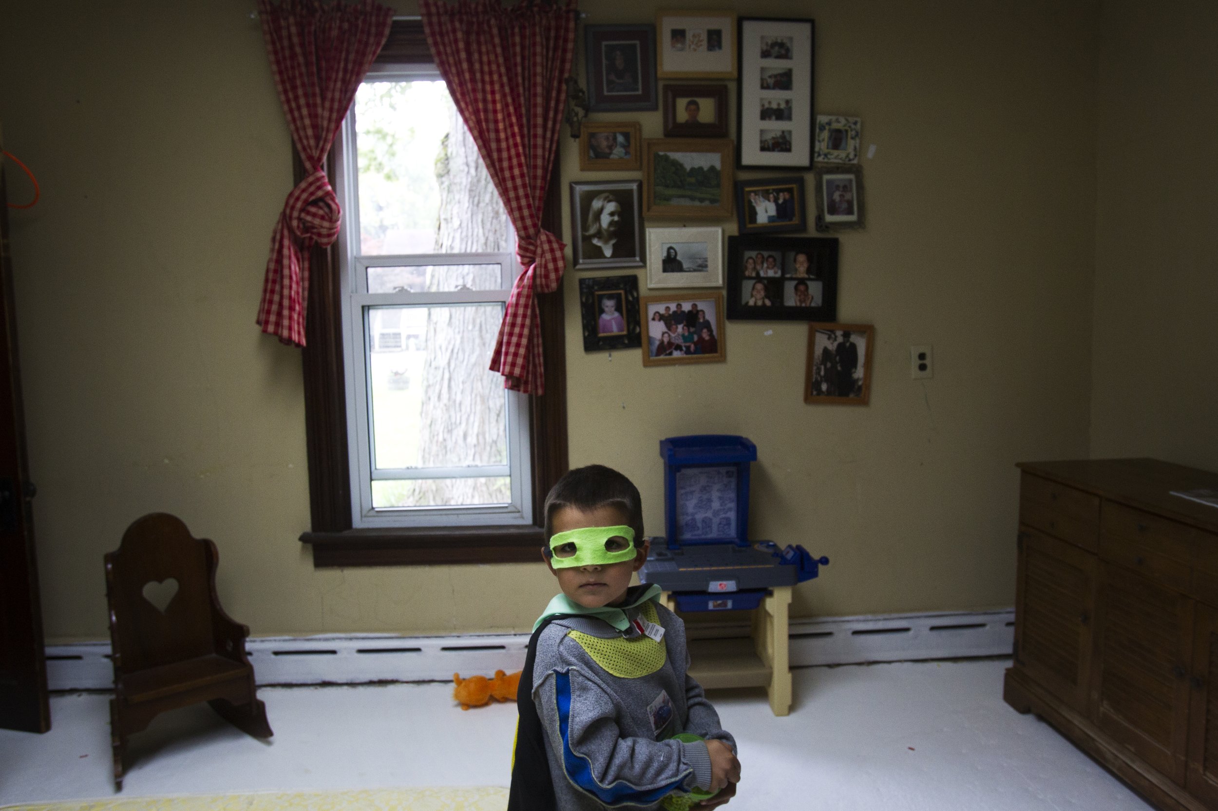  Rebecca Acosta's son plays in their family's house as she makes lunch at her home in Pemberville on Oct. 2, 2012. The town of Pemberville is a close knit community and Rebecca said the town's child-friendly atmosphere was important to her family.  